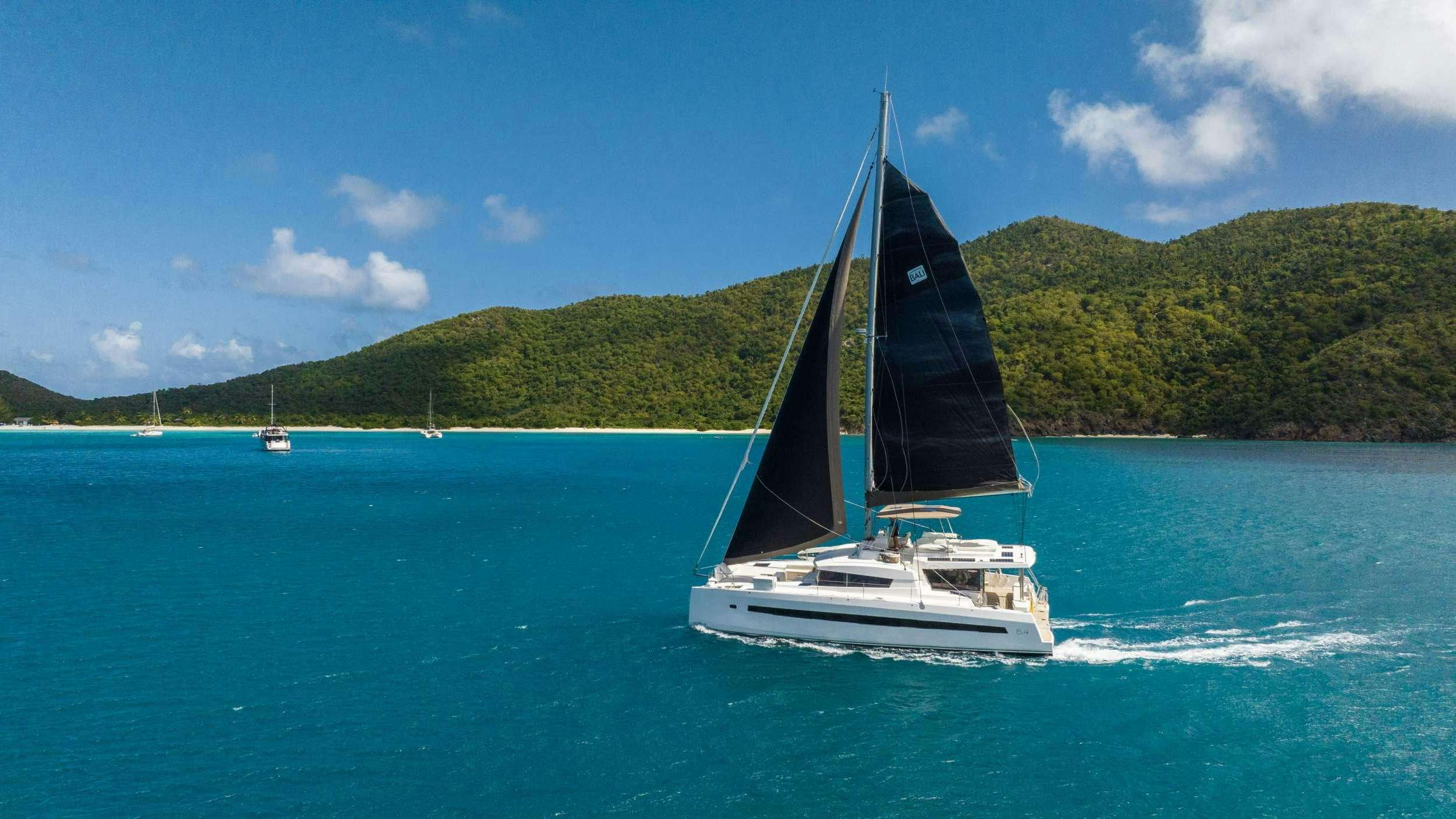 a sailboat on the water aboard HYDROTHERAPY Yacht for Charter