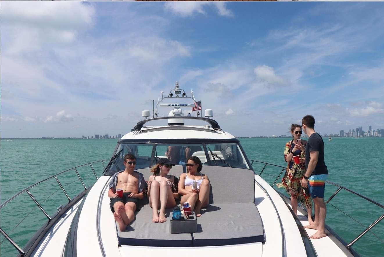 a group of people on a boat aboard SWEET THING Yacht for Charter