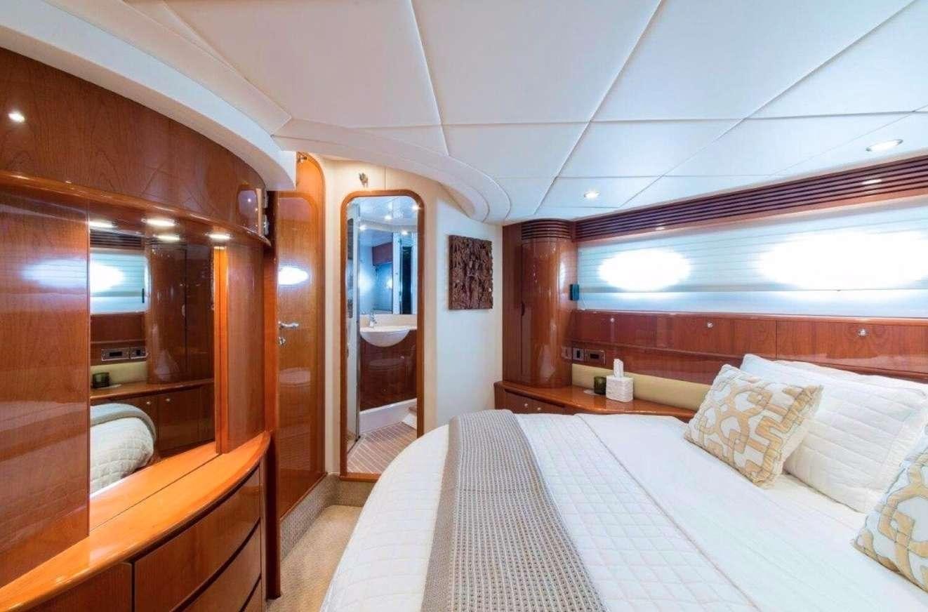 a room with a bed and a mirror aboard SWEET THING Yacht for Charter