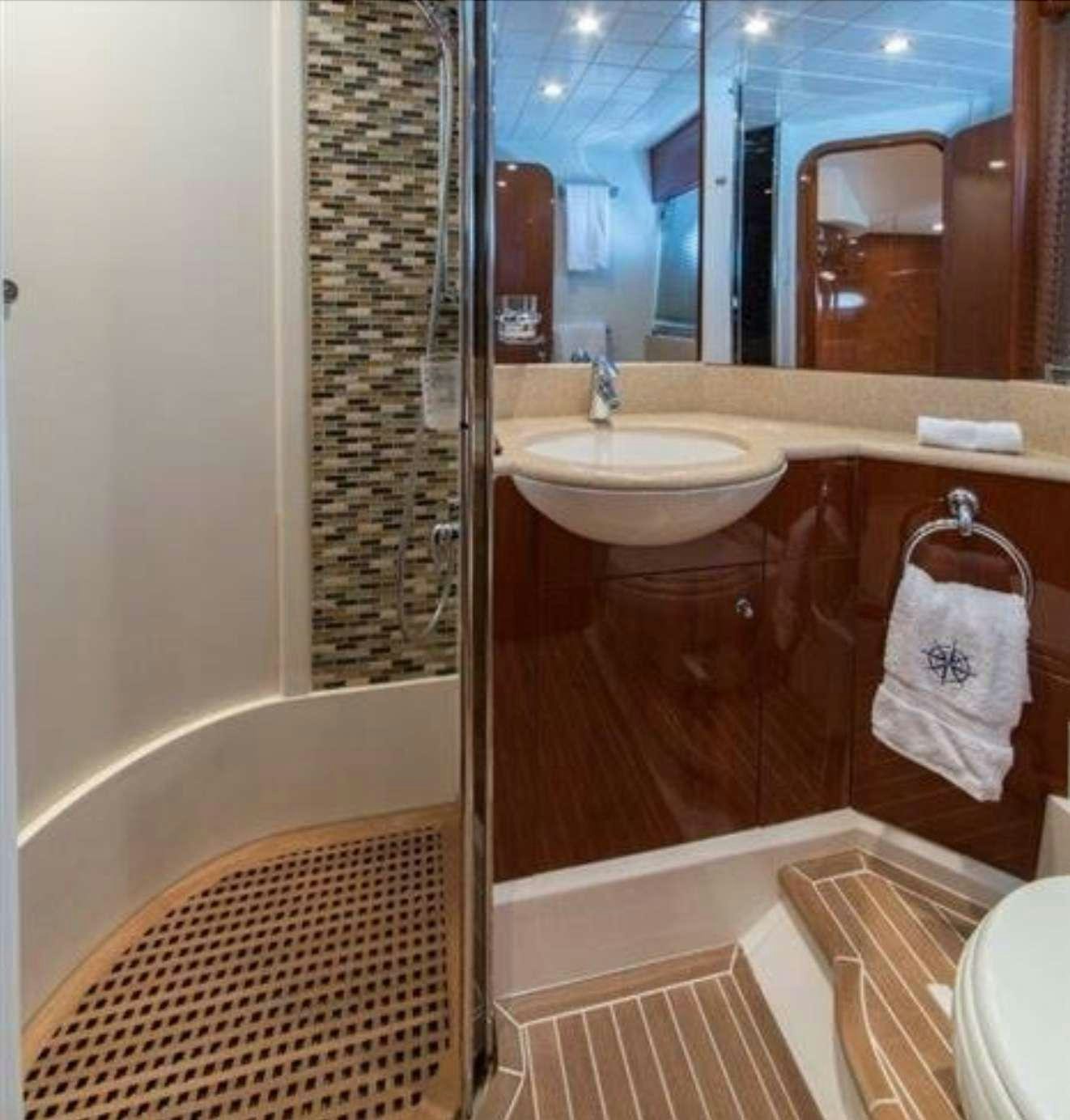 a bathroom with a sink and a bathtub aboard SWEET THING Yacht for Charter
