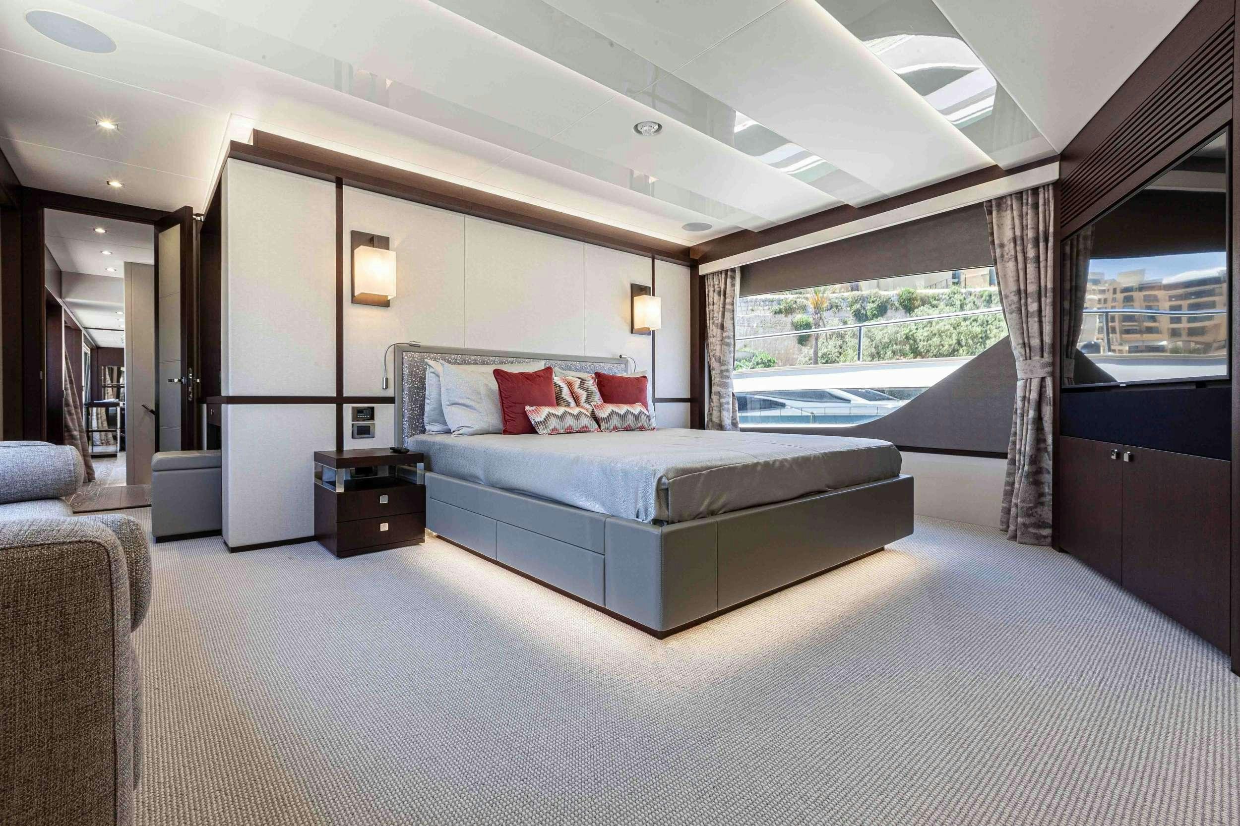a large bedroom with a large bed aboard NEW EDGE Yacht for Charter