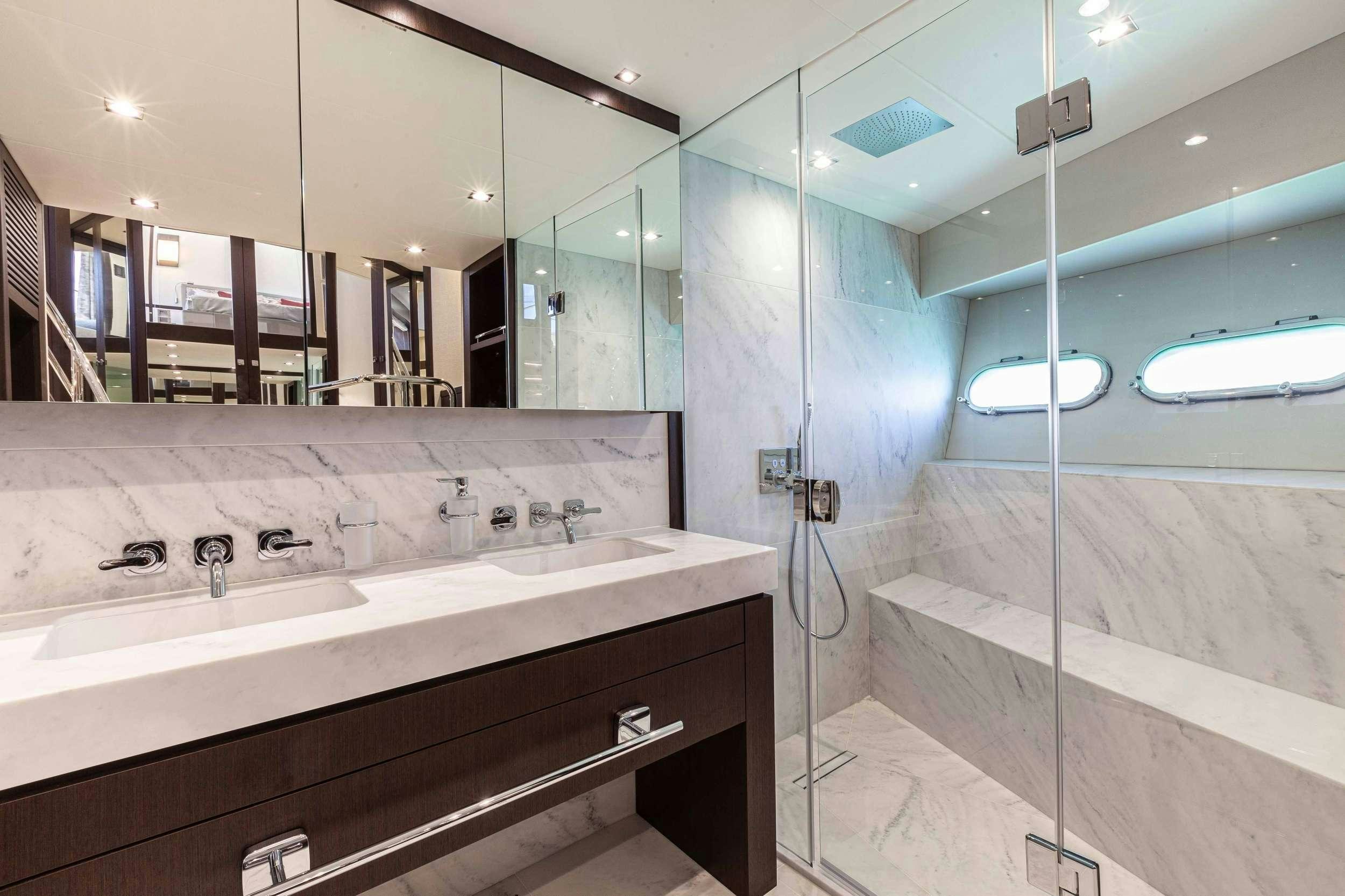 a bathroom with a large mirror aboard NEW EDGE Yacht for Charter