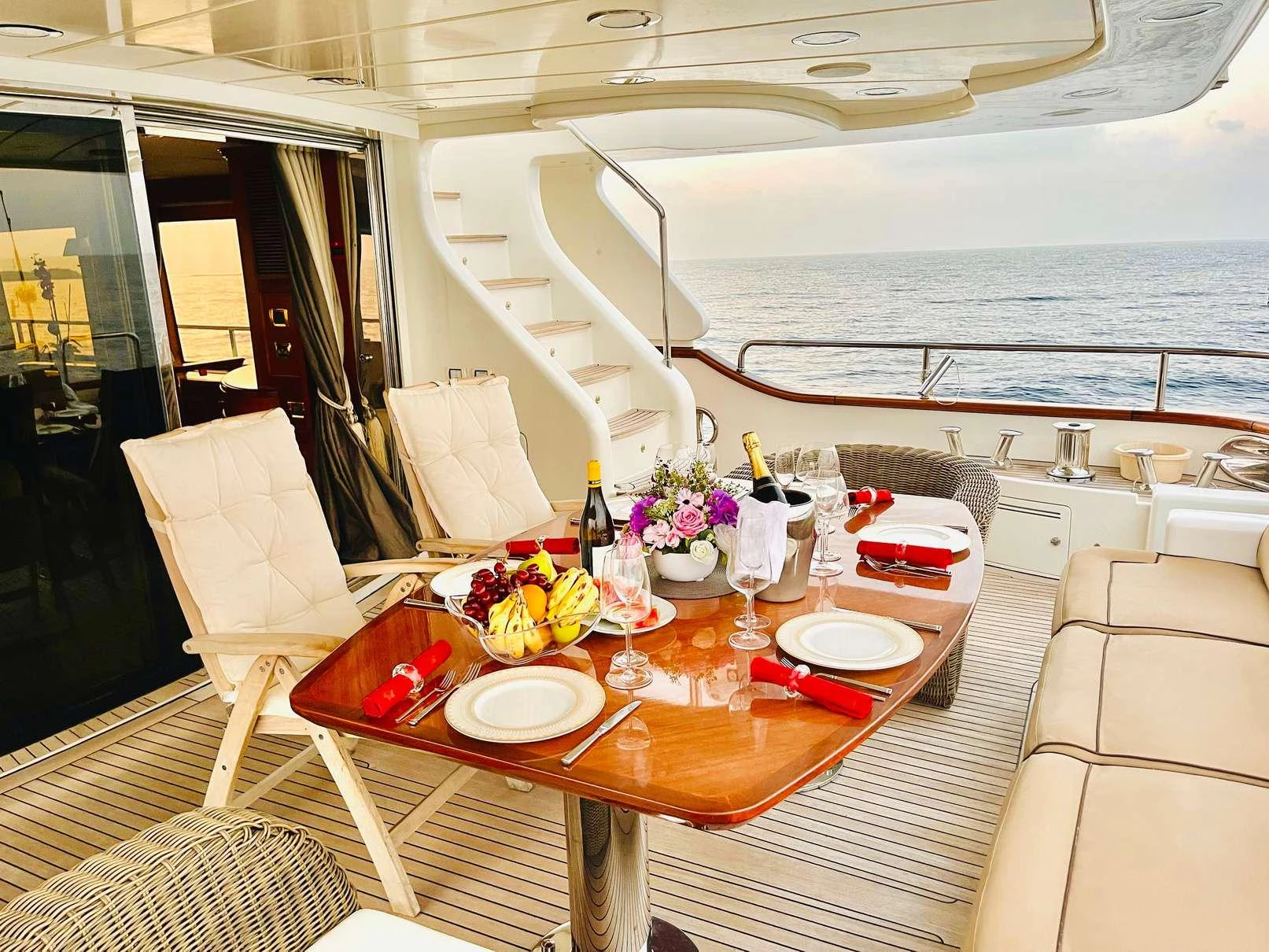 a table with plates and glasses on it aboard GALAKTIKA SKAY Yacht for Charter