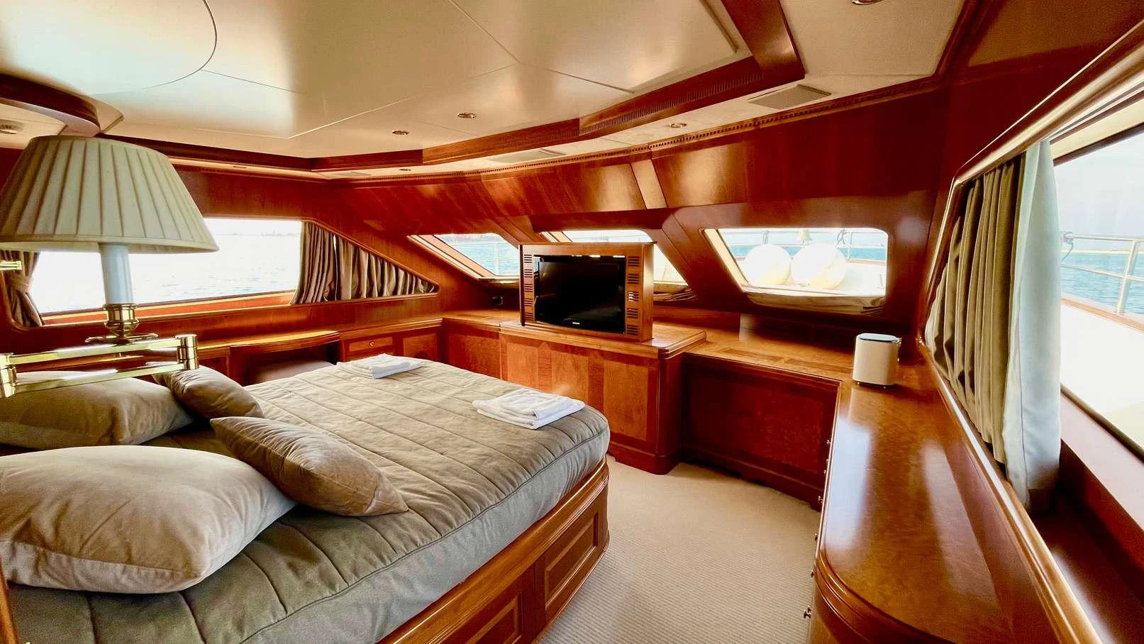 a bedroom with a bed and a tv aboard GALAKTIKA SKAY Yacht for Charter