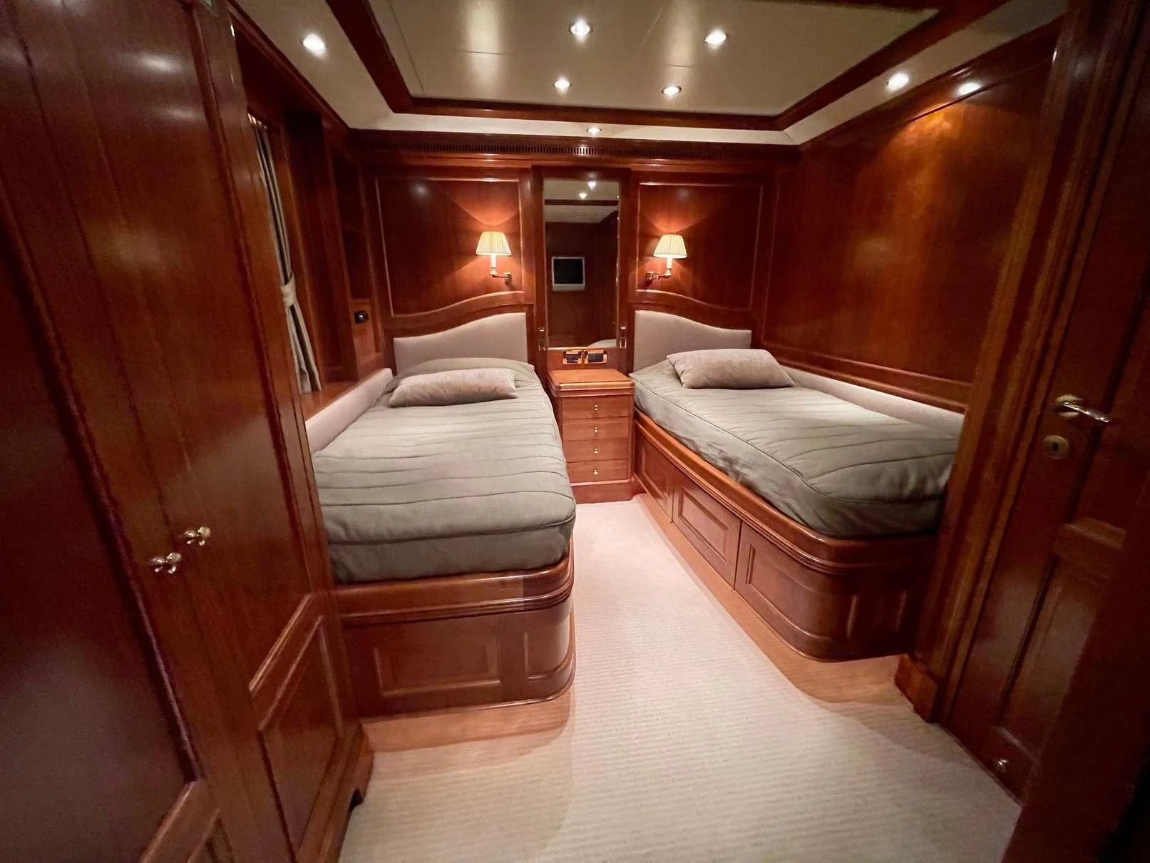 a room with a bed and a wood door aboard GALAKTIKA SKAY Yacht for Charter