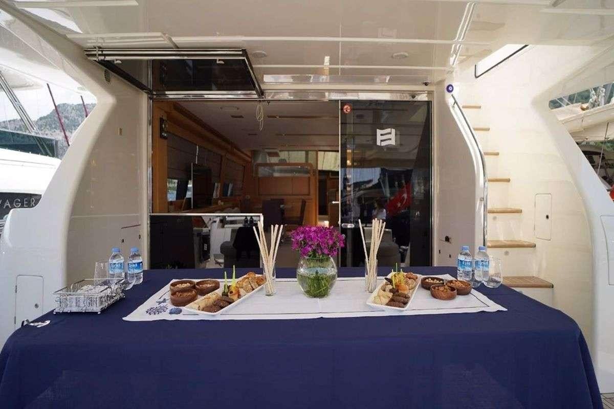 a table with food on it aboard REINE DES COEURS Yacht for Charter
