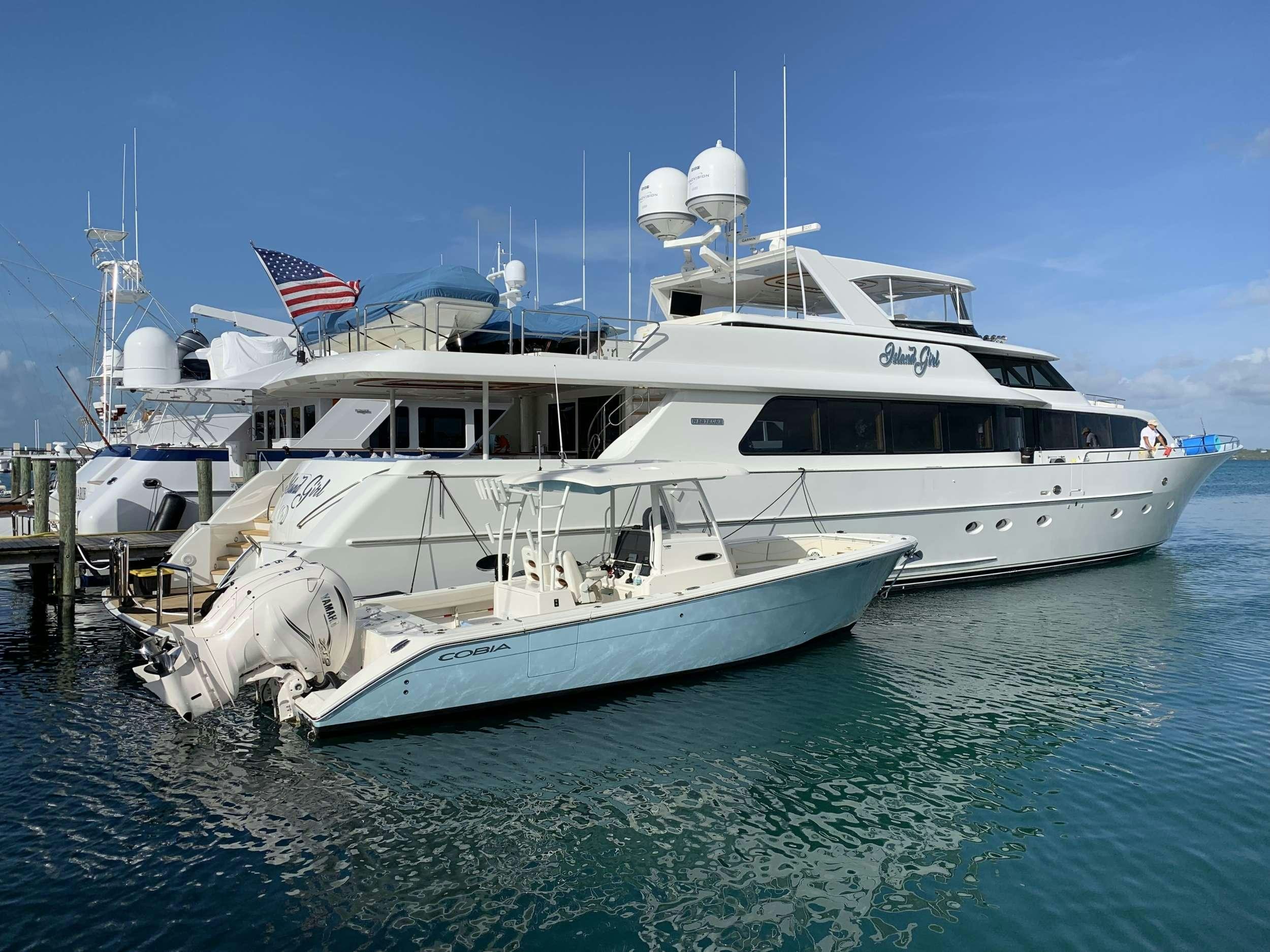 a large white boat in the water aboard ISLAND GIRL Yacht for Charter