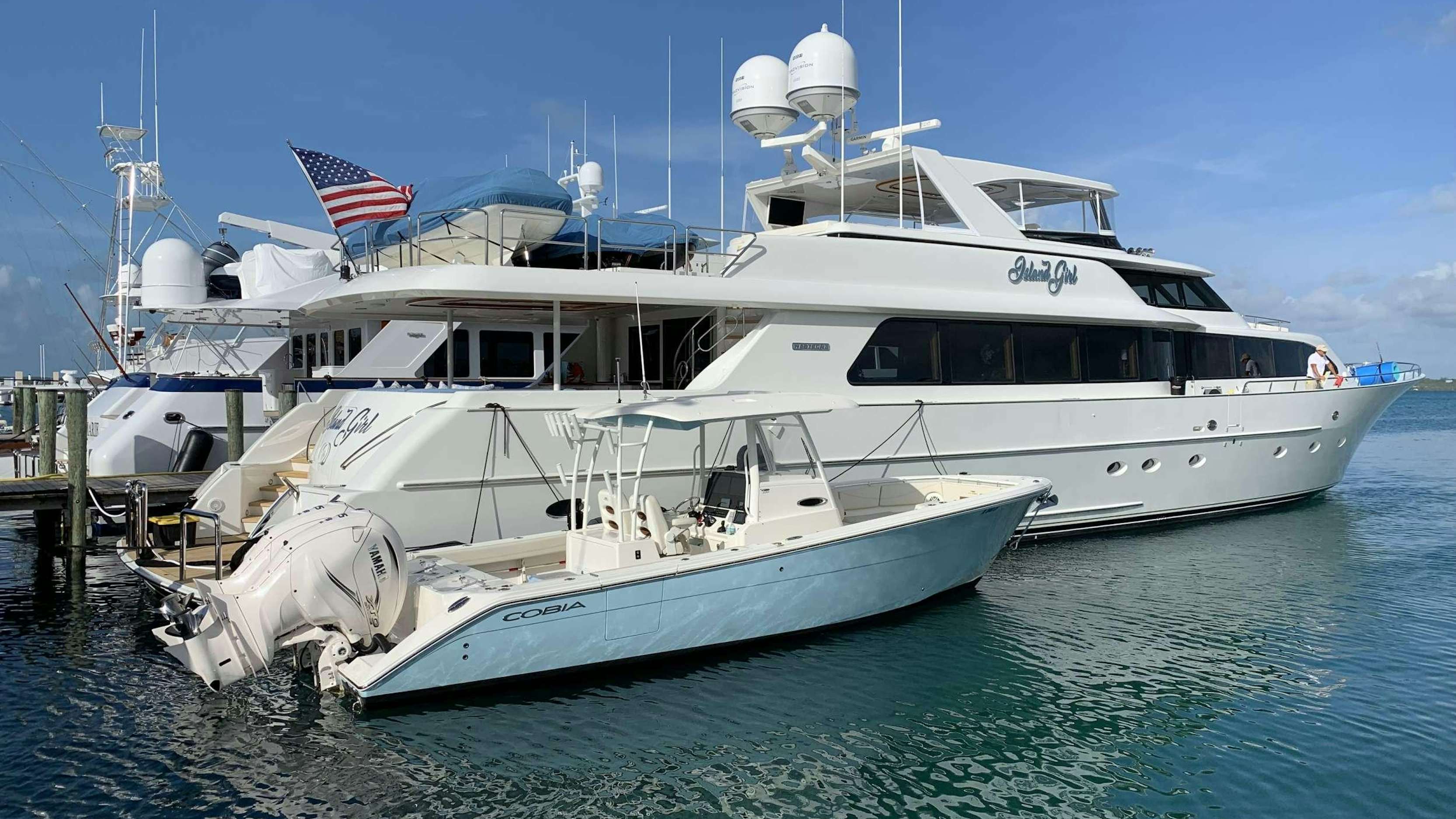 a large white boat in the water aboard ISLAND GIRL Yacht for Charter