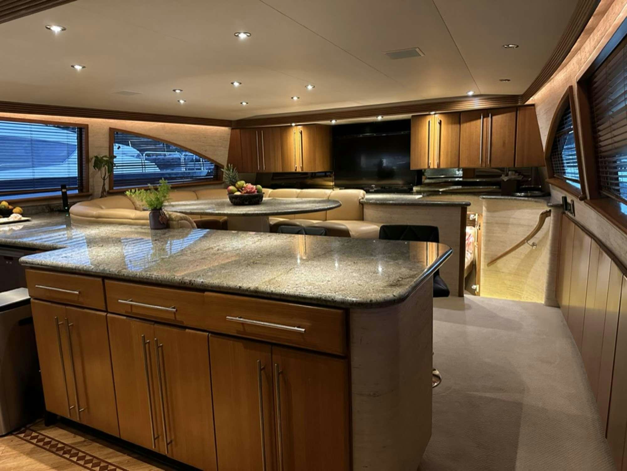 a large kitchen with a large island aboard ISLAND GIRL Yacht for Charter