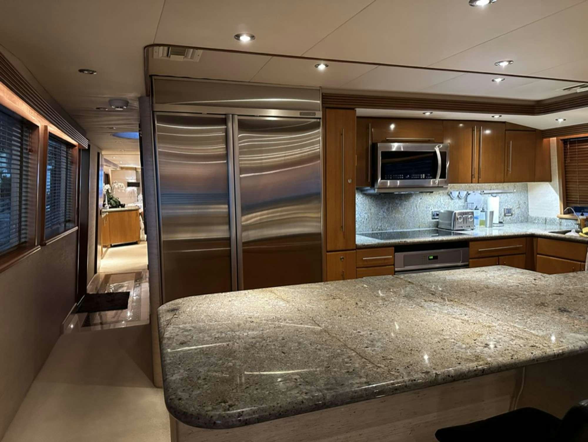 a kitchen with a large glass door aboard ISLAND GIRL Yacht for Charter