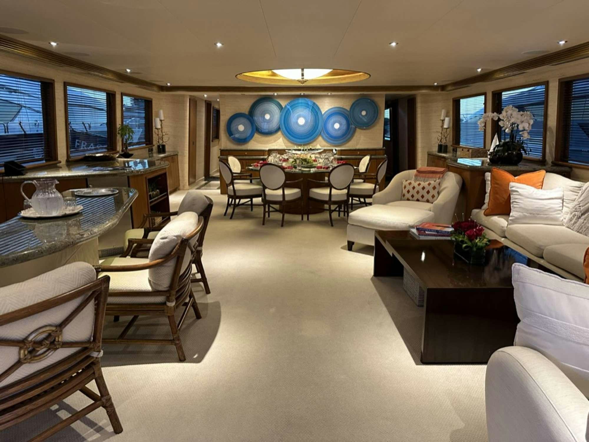 a living room with a large window aboard ISLAND GIRL Yacht for Charter