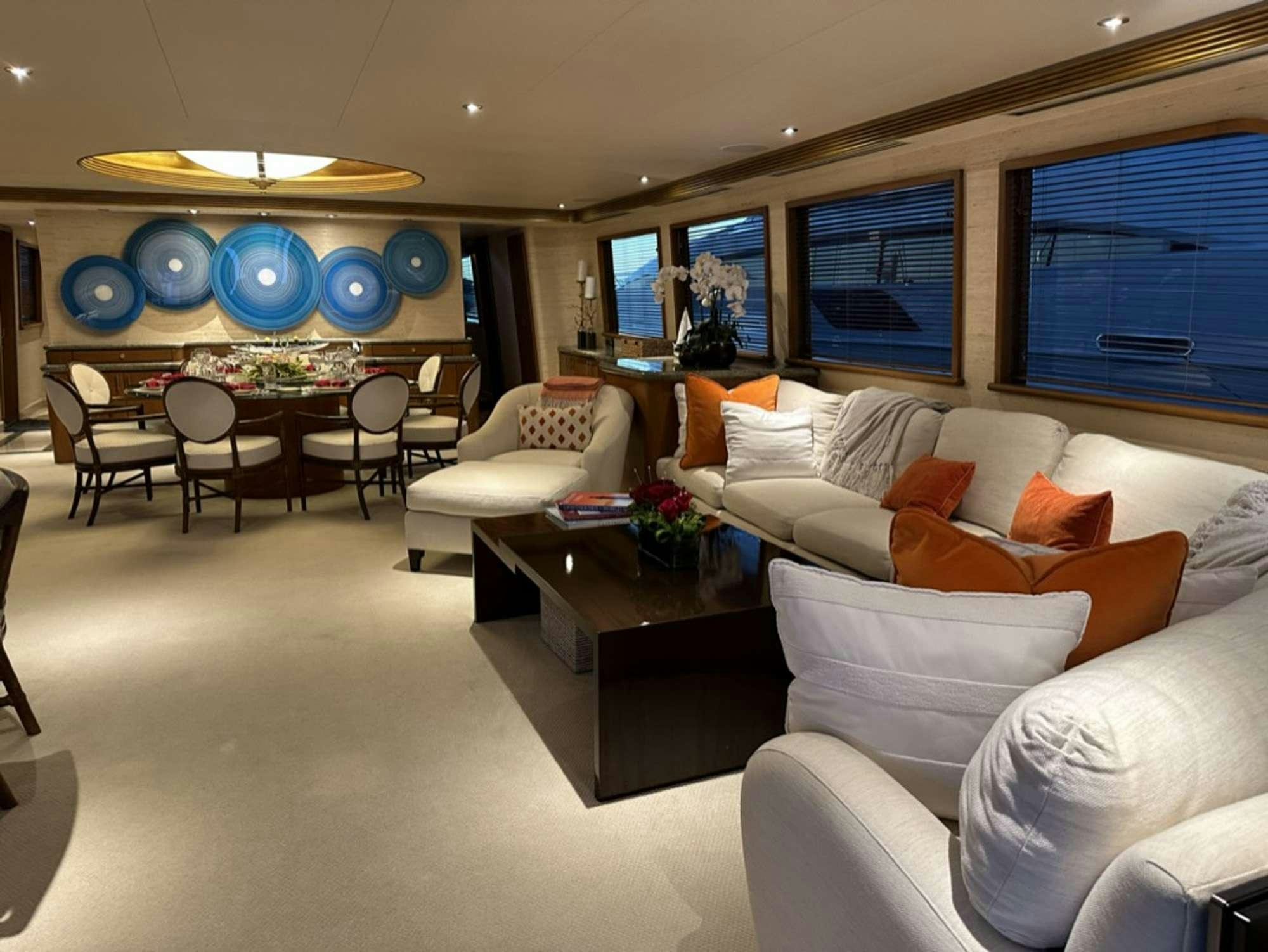 a living room with white couches aboard ISLAND GIRL Yacht for Charter