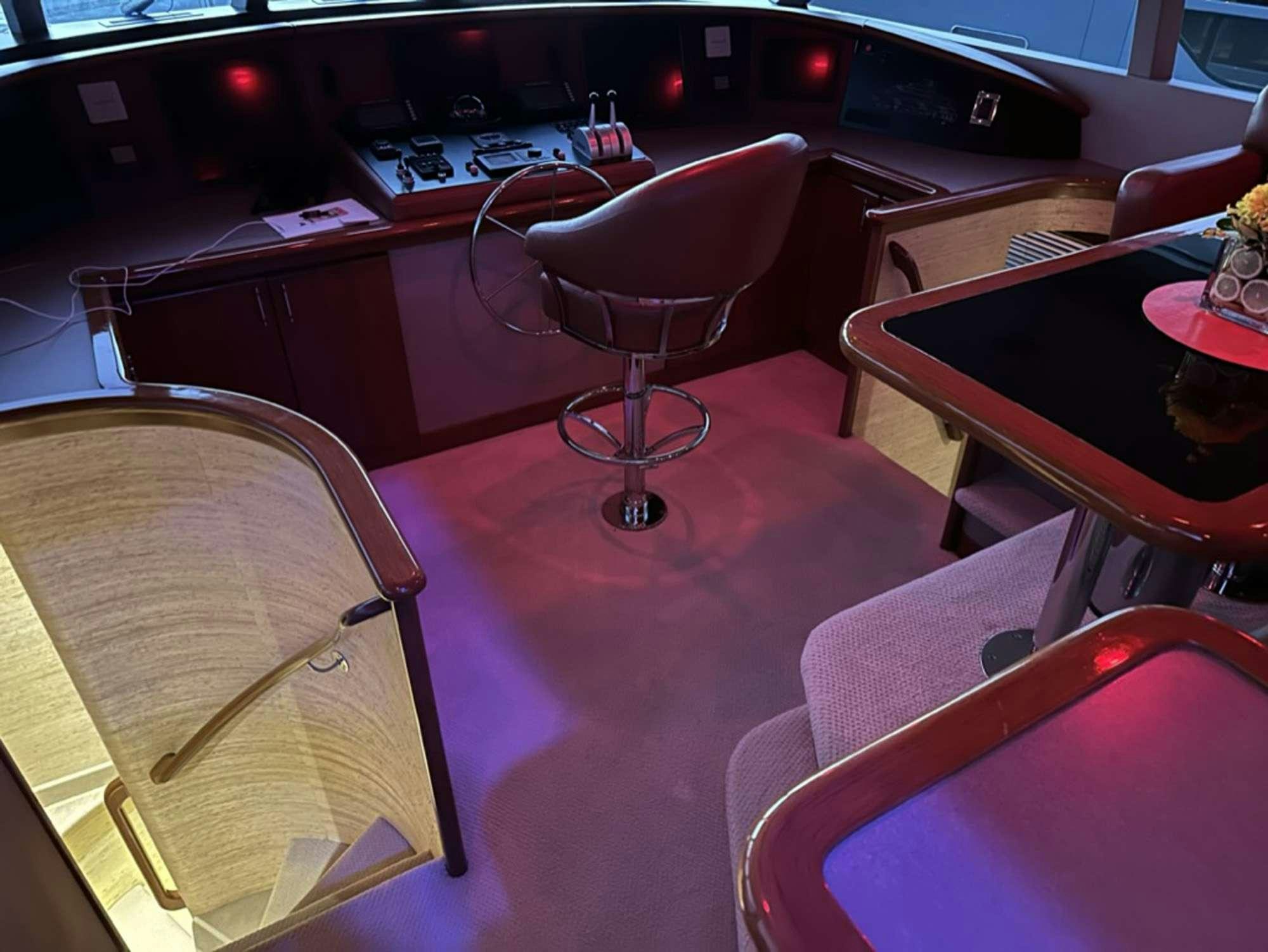 a room with a table and chairs aboard ISLAND GIRL Yacht for Charter