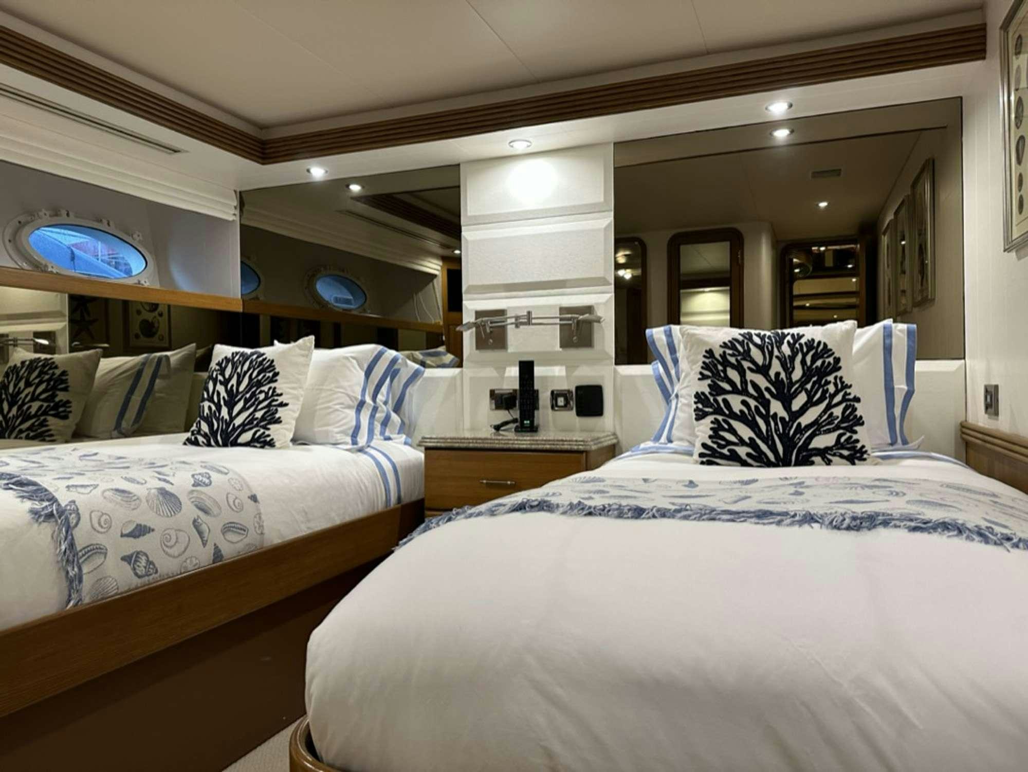 a room with two beds aboard ISLAND GIRL Yacht for Charter