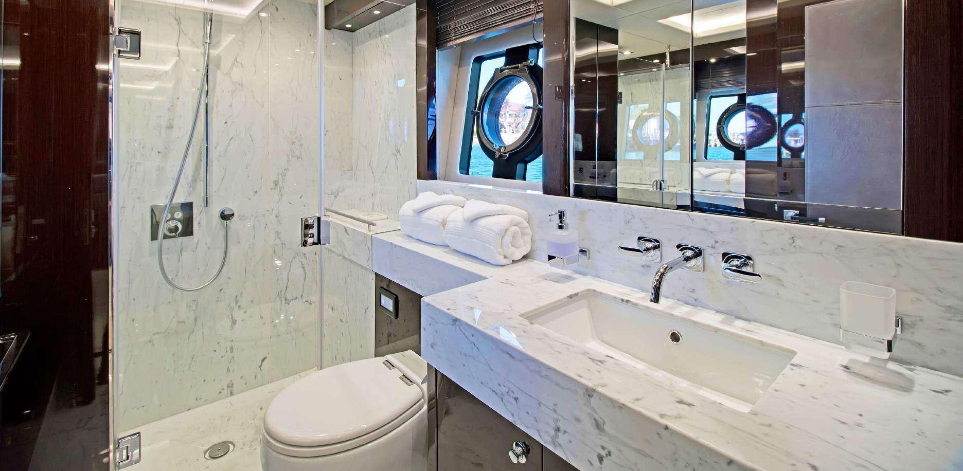 a bathroom with a sink and a toilet aboard SYNERGY Yacht for Charter