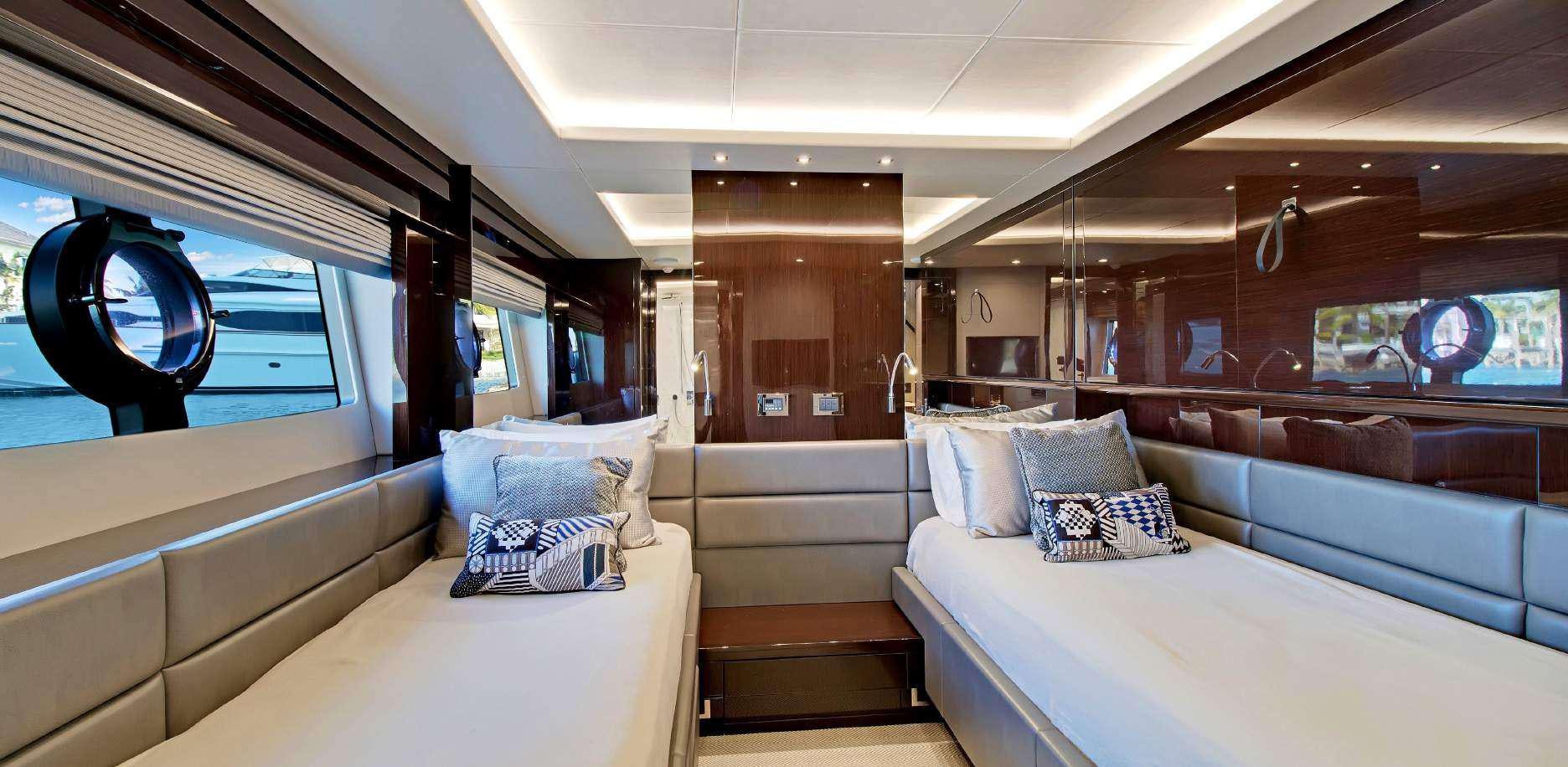 a room with a bed and a couch aboard SYNERGY Yacht for Charter