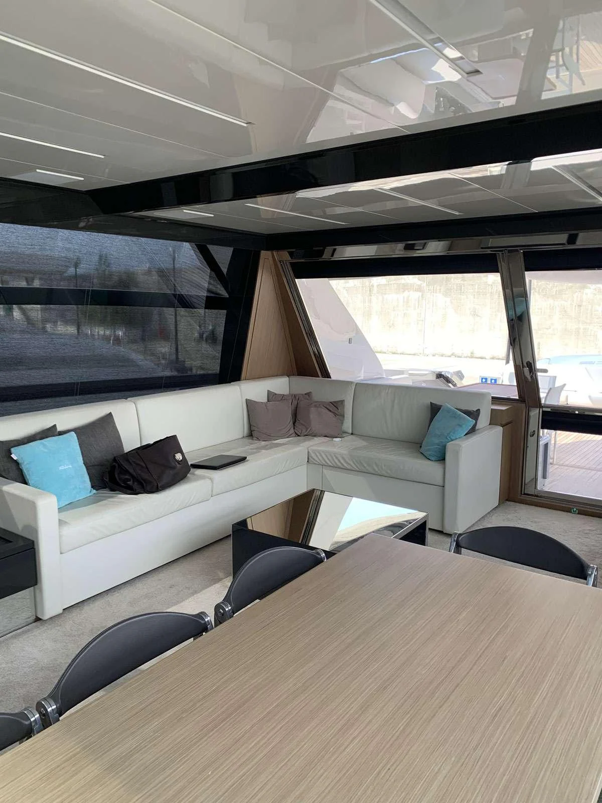 a room with a couch and a table aboard CHILUCE Yacht for Charter