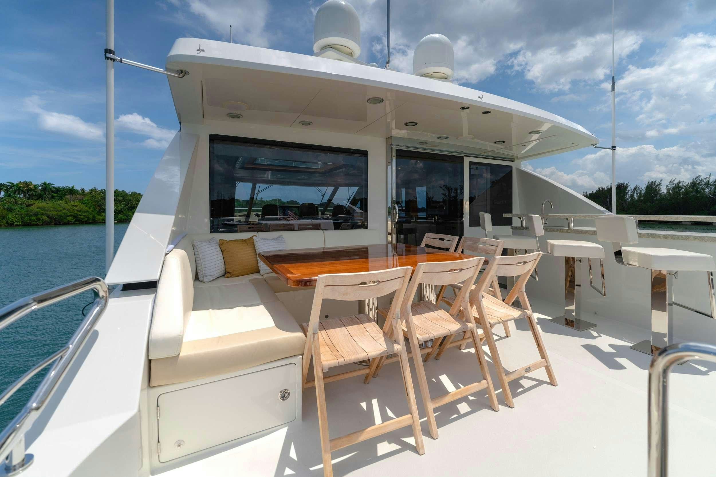 a boat with chairs on the deck aboard ZEPHYR Yacht for Charter