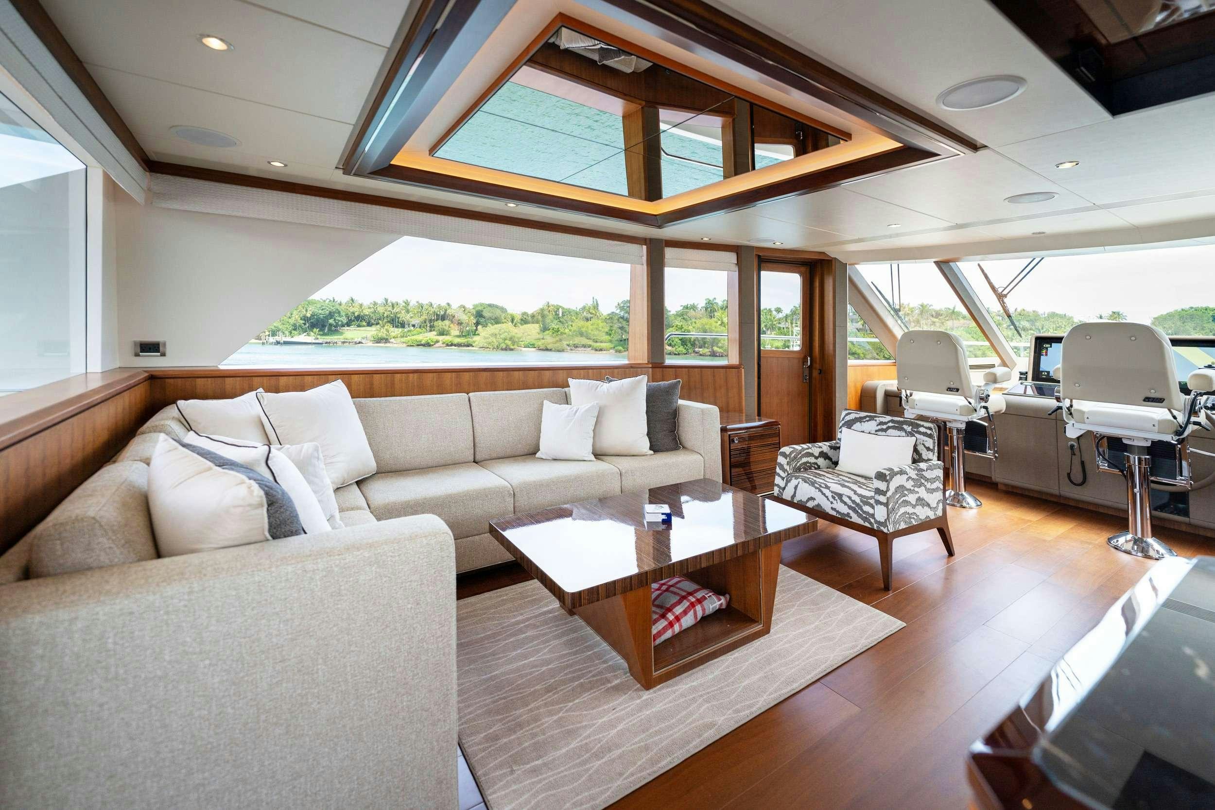 a living room with a couch and a table aboard ZEPHYR Yacht for Charter