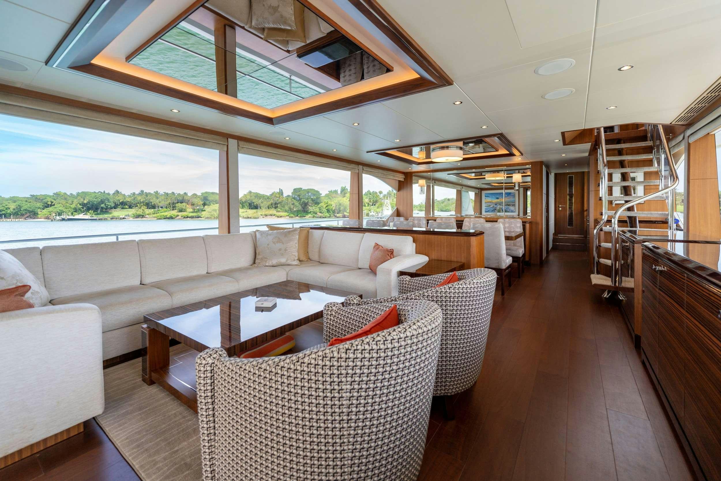 a living room with a large window aboard ZEPHYR Yacht for Charter