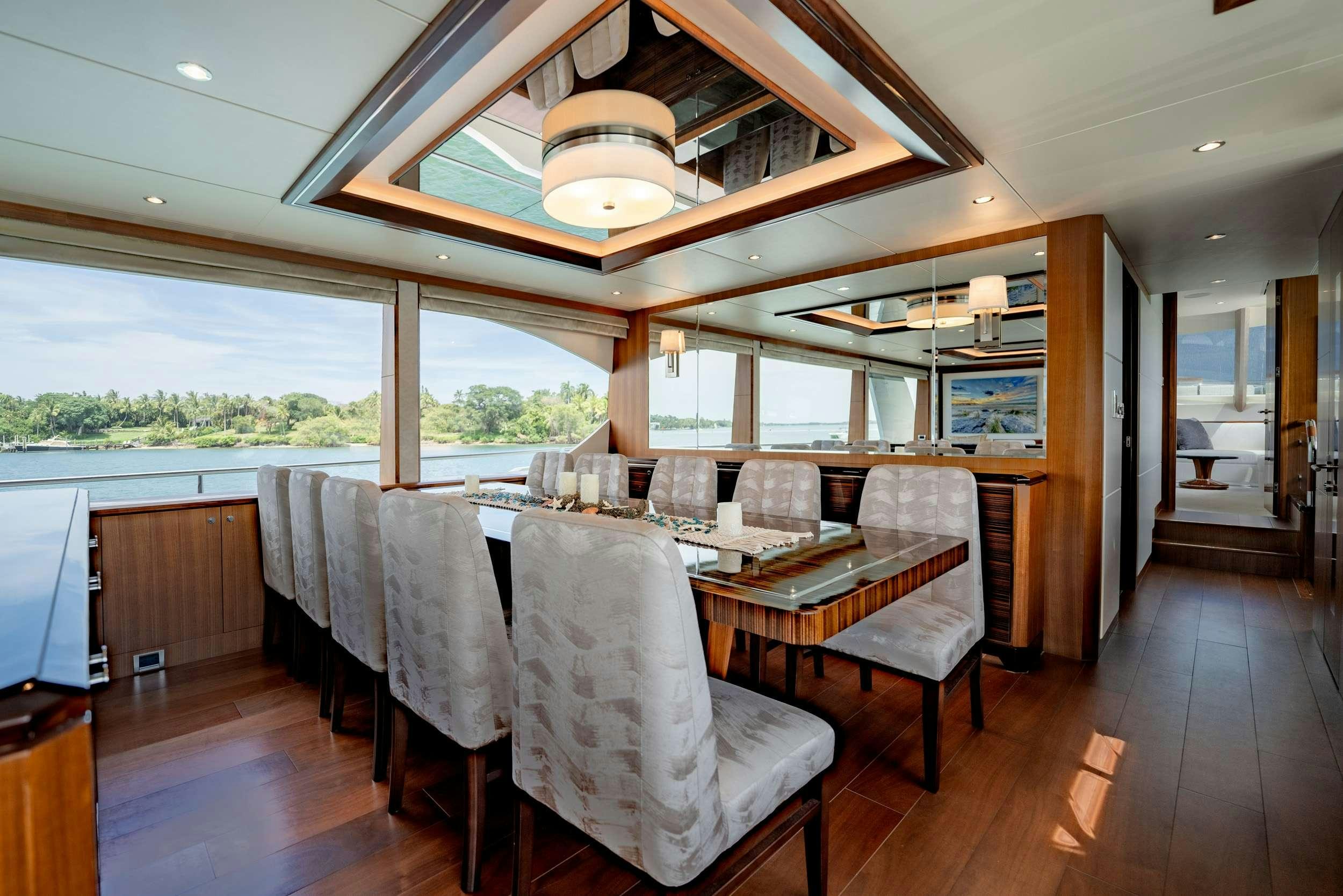 a large dining room with a large open window aboard ZEPHYR Yacht for Charter