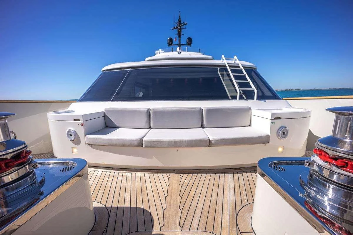 a white boat on a deck aboard PHOENIX Yacht for Charter