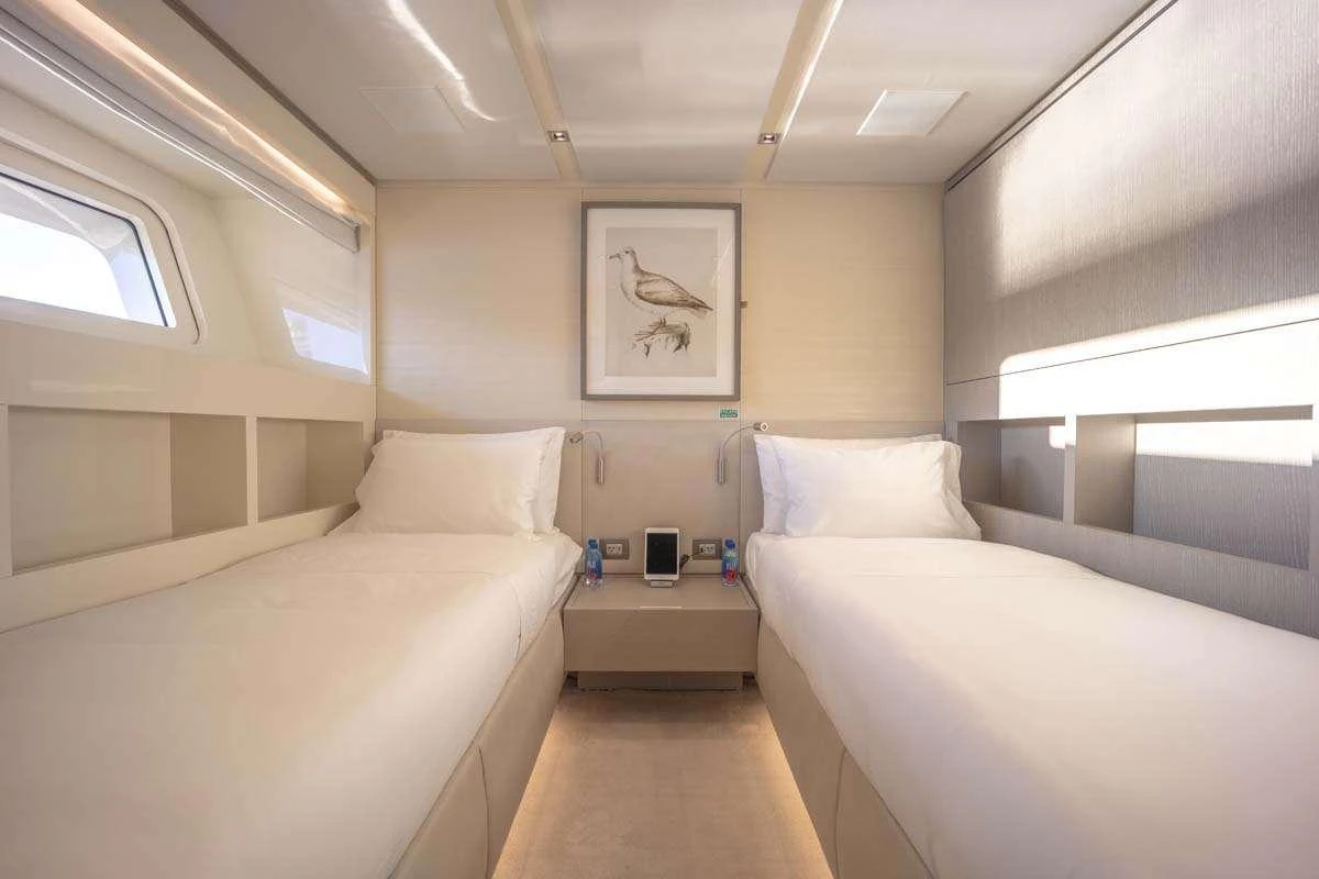 a room with two beds aboard PHOENIX Yacht for Charter