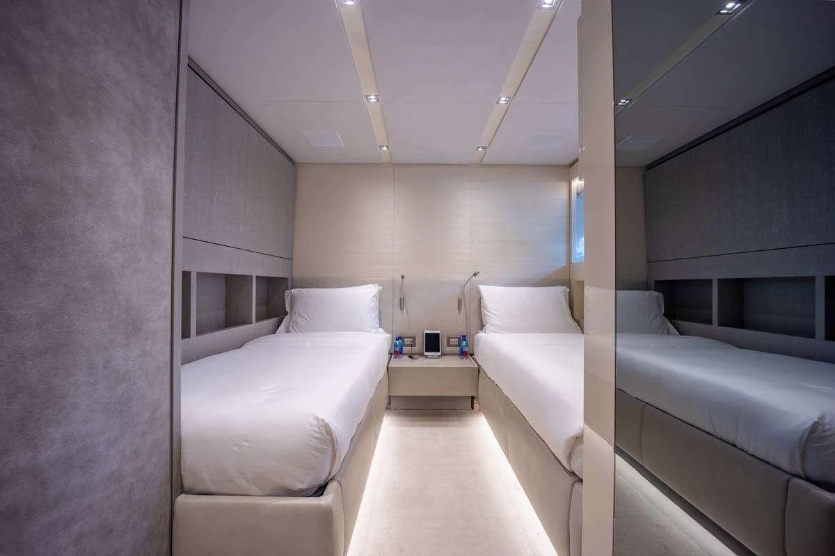 a room with a bed and a couch aboard PHOENIX Yacht for Charter