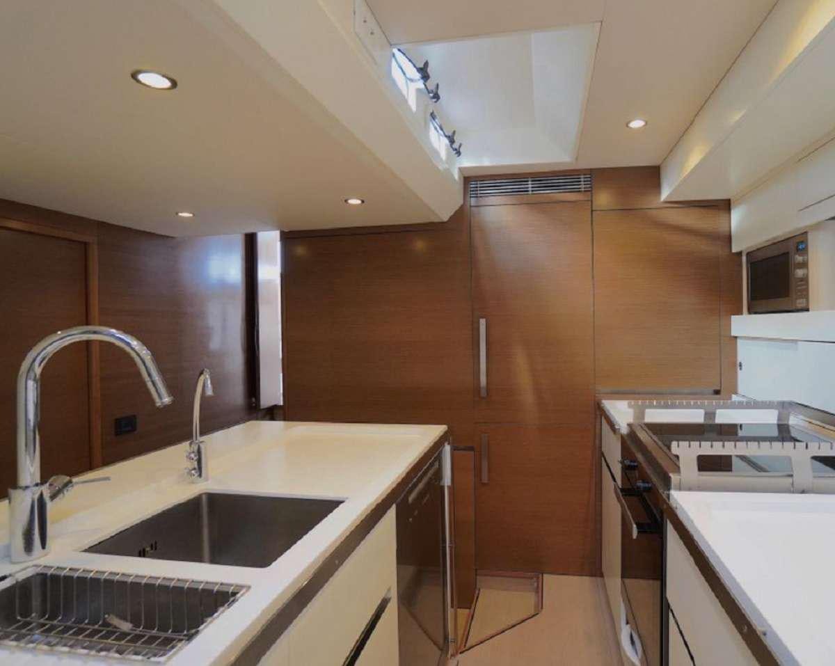 a kitchen with a sink and a stove aboard AENEA Yacht for Charter