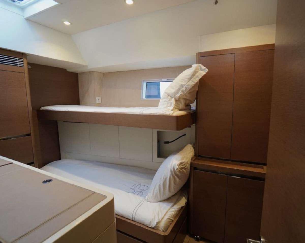 a room with two beds aboard AENEA Yacht for Charter