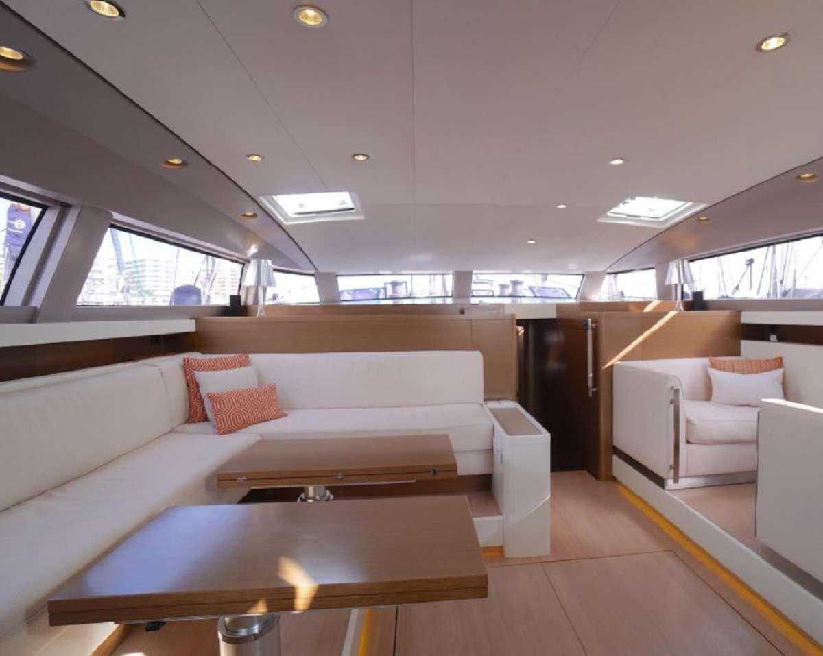 a room with a couch and a table aboard AENEA Yacht for Charter