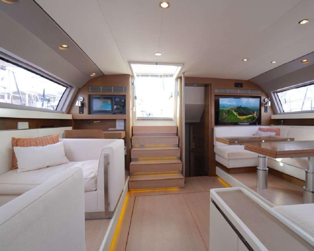 a room with a couch and a table aboard AENEA Yacht for Charter