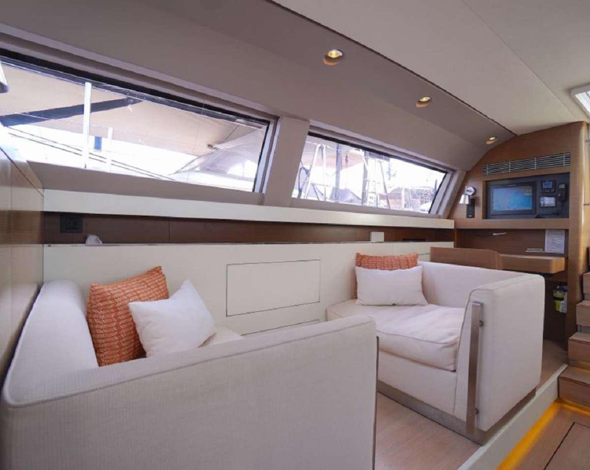 a room with couches and a television aboard AENEA Yacht for Charter