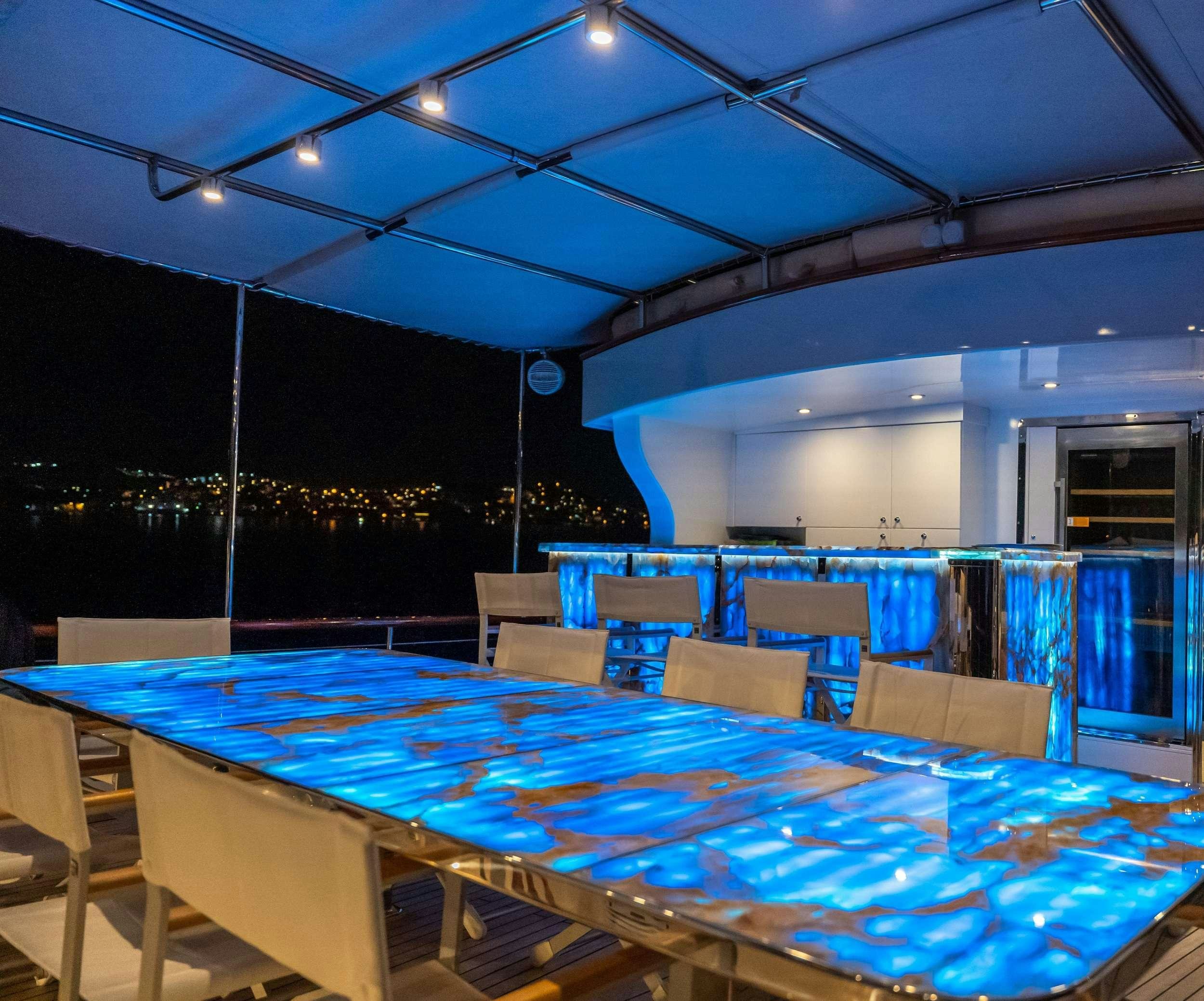 a large room with tables and chairs aboard DOUBLE EAGLE Yacht for Charter