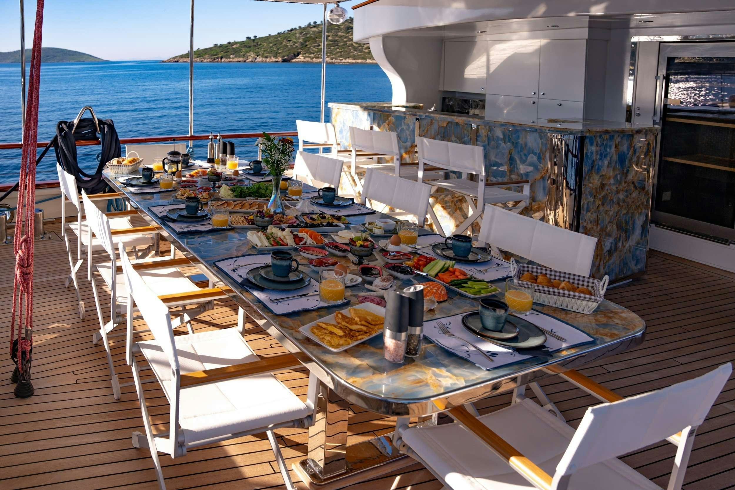 a table with food on it aboard DOUBLE EAGLE Yacht for Charter