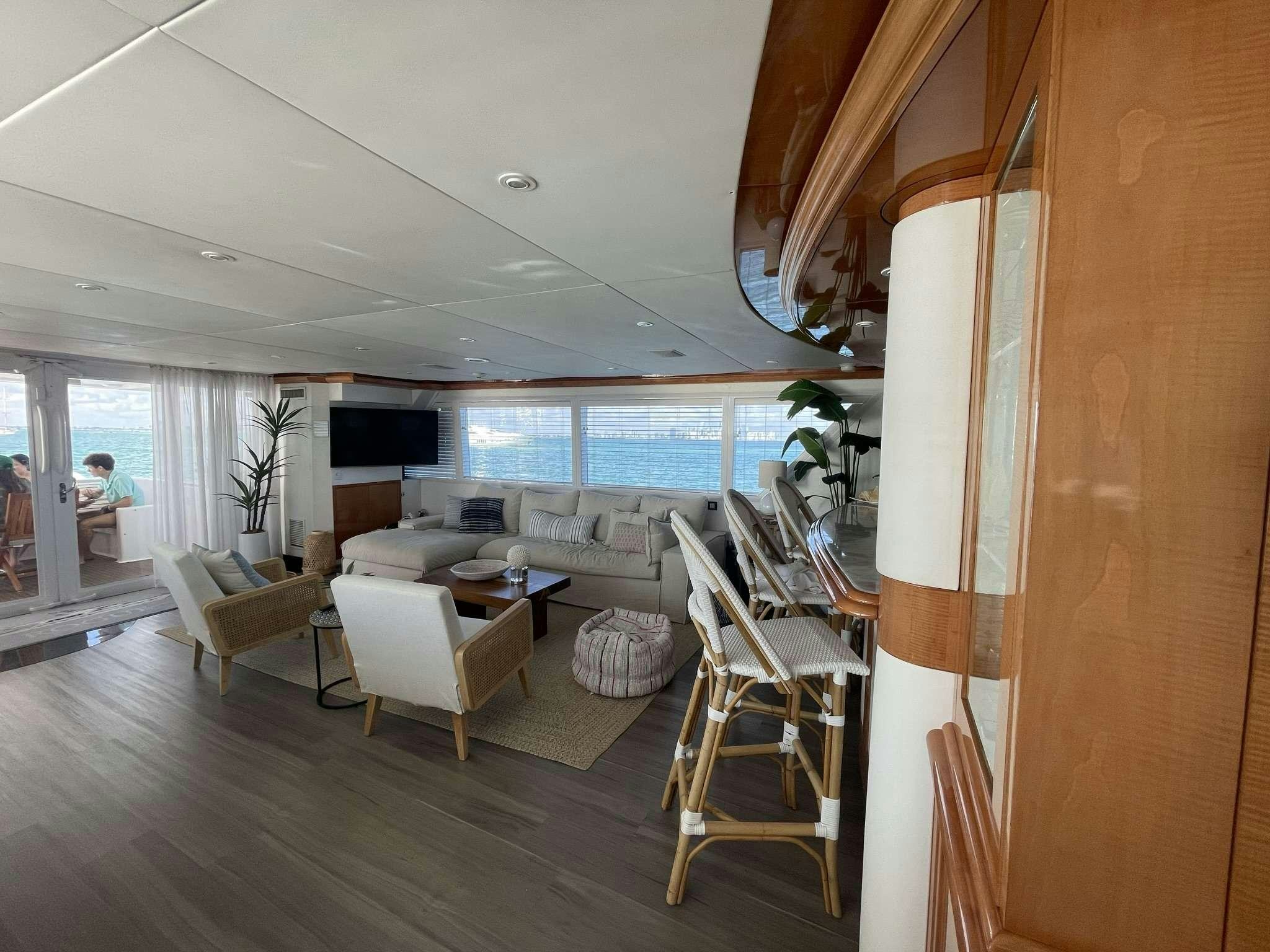 a living room with a wood floor aboard ROGUE Yacht for Charter