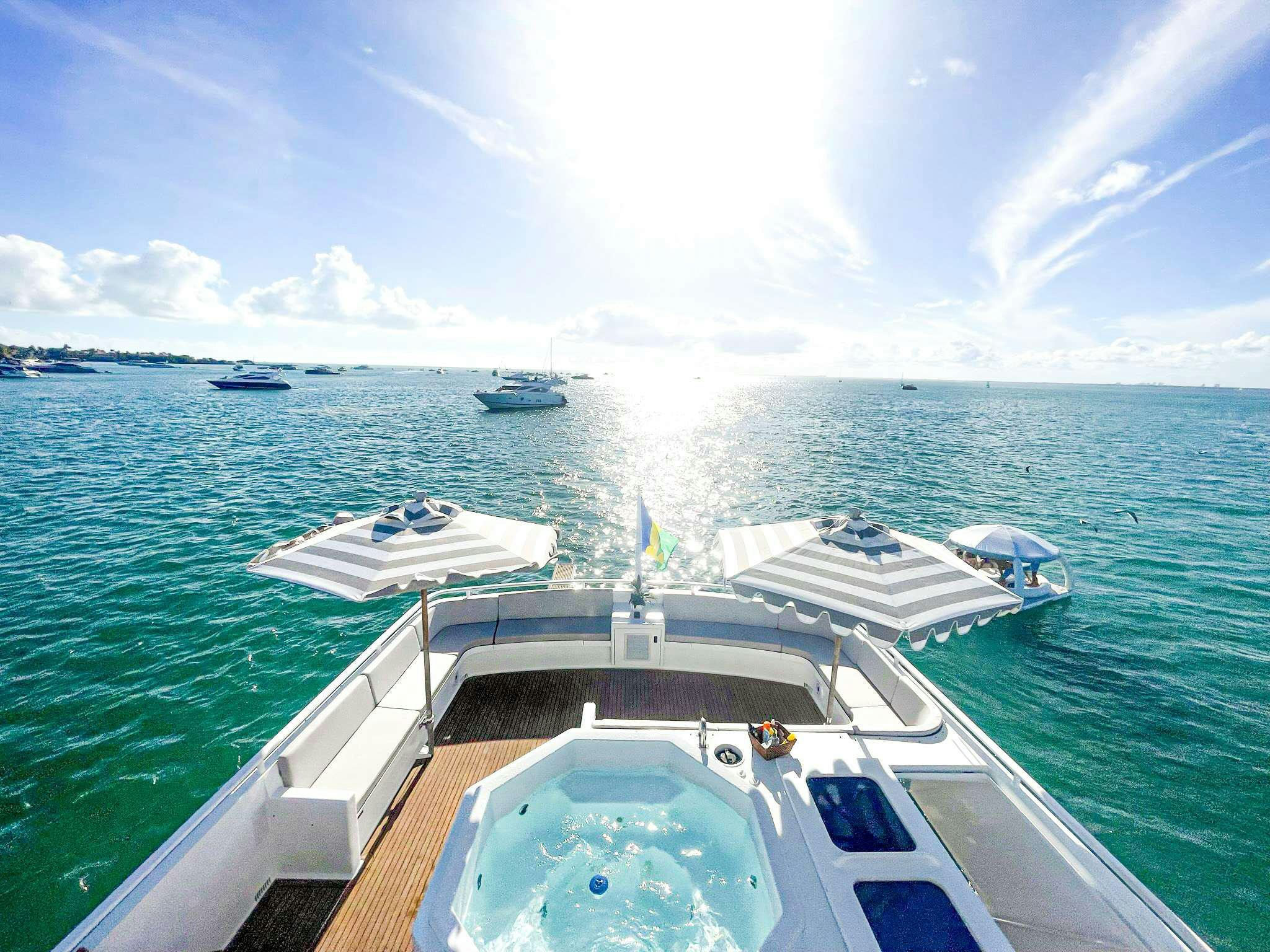 a group of boats on a body of water aboard ROGUE Yacht for Charter