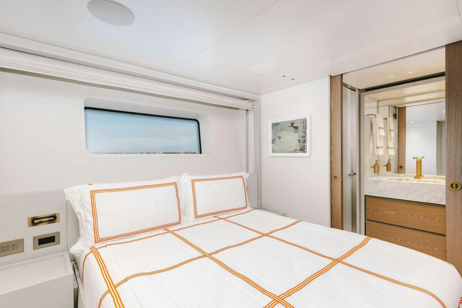a bedroom with a bed aboard PEARL Yacht for Charter