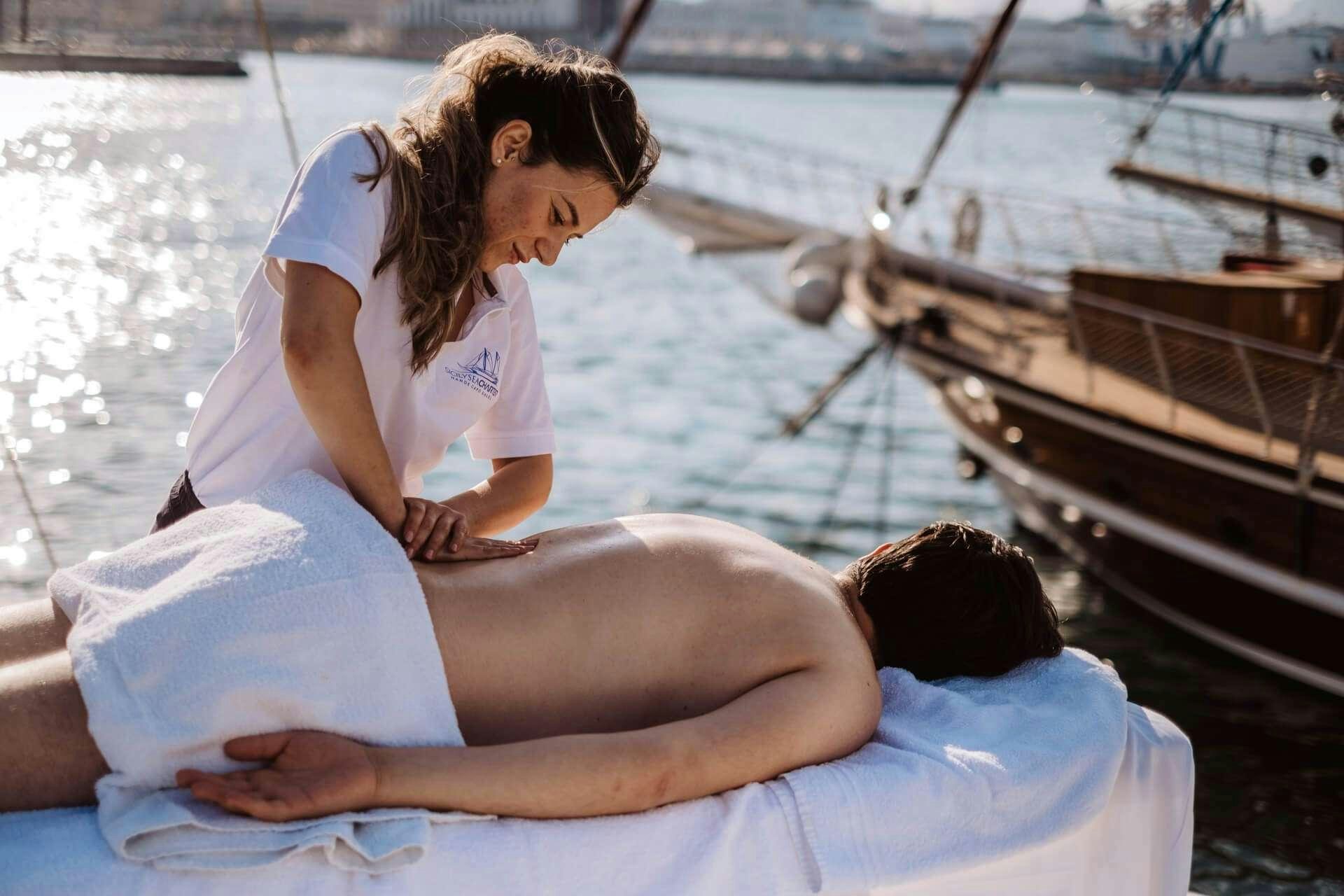 a woman and a man sitting on a boat aboard HANDE CAPO GALERA Yacht for Charter