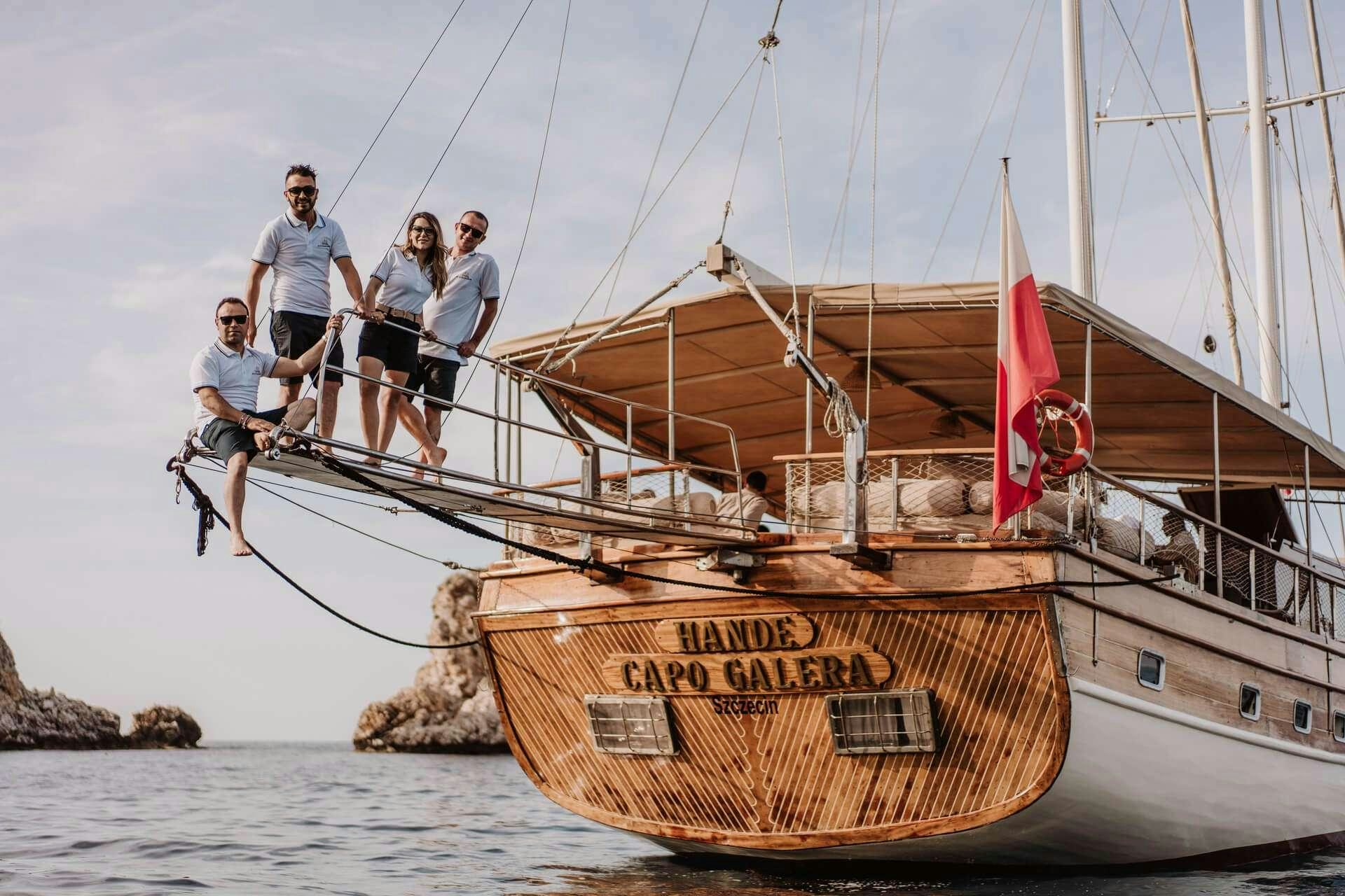 a group of people on a boat aboard HANDE CAPO GALERA Yacht for Charter