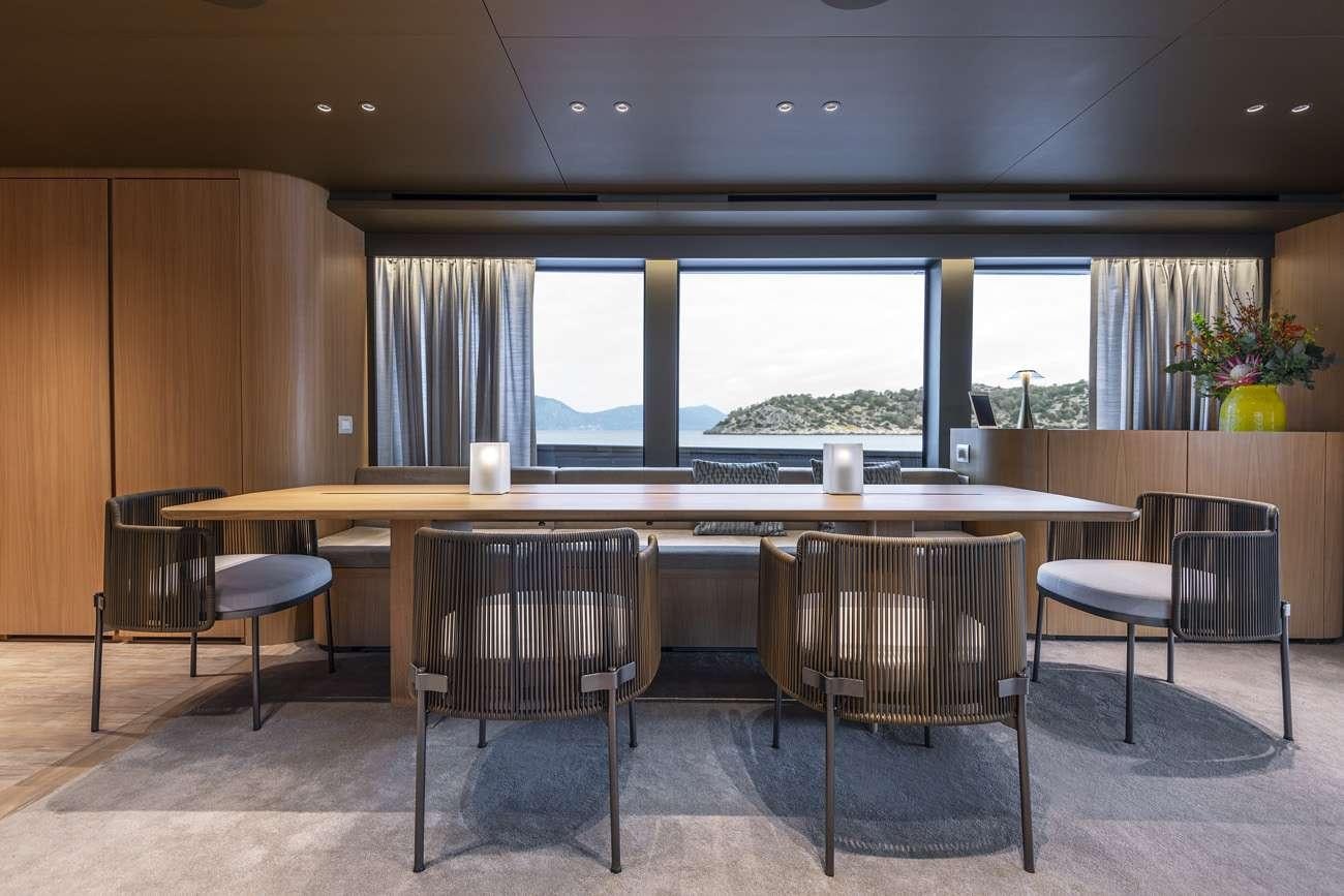 a table and chairs in a room aboard FATSA Yacht for Charter
