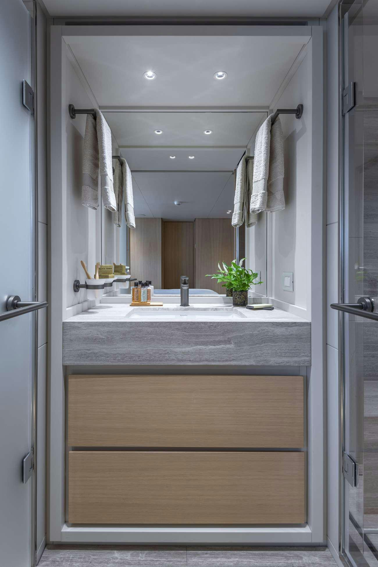 a bathroom with a large mirror aboard FATSA Yacht for Charter