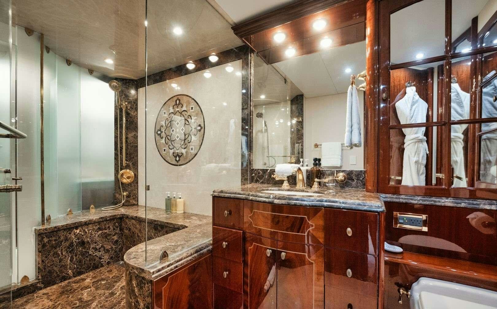 a bathroom with a large marble countertop aboard LADY KRISTINA Yacht for Charter