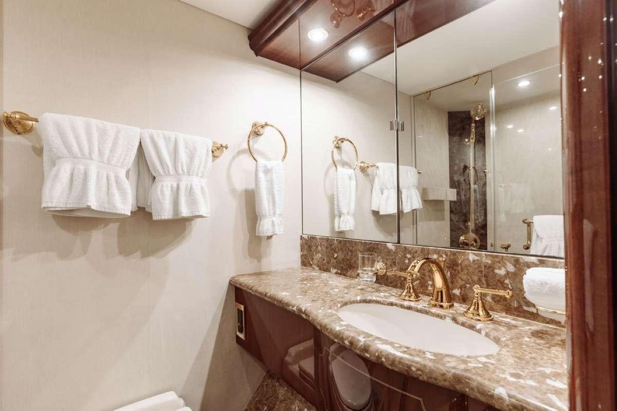 a bathroom with a large mirror aboard LADY KRISTINA Yacht for Charter
