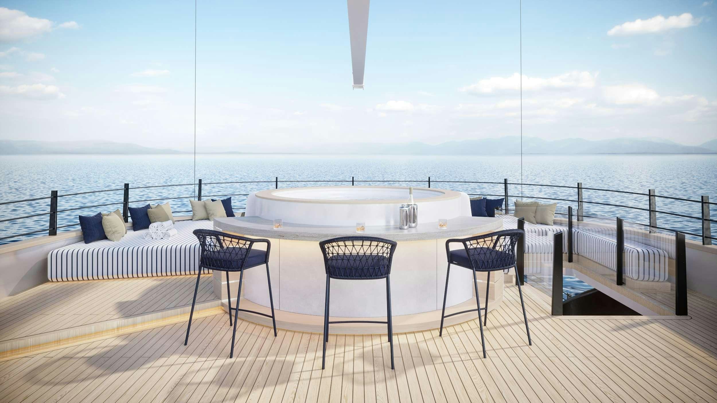 a table and chairs on a deck overlooking a body of water aboard SCORPIOS Yacht for Charter