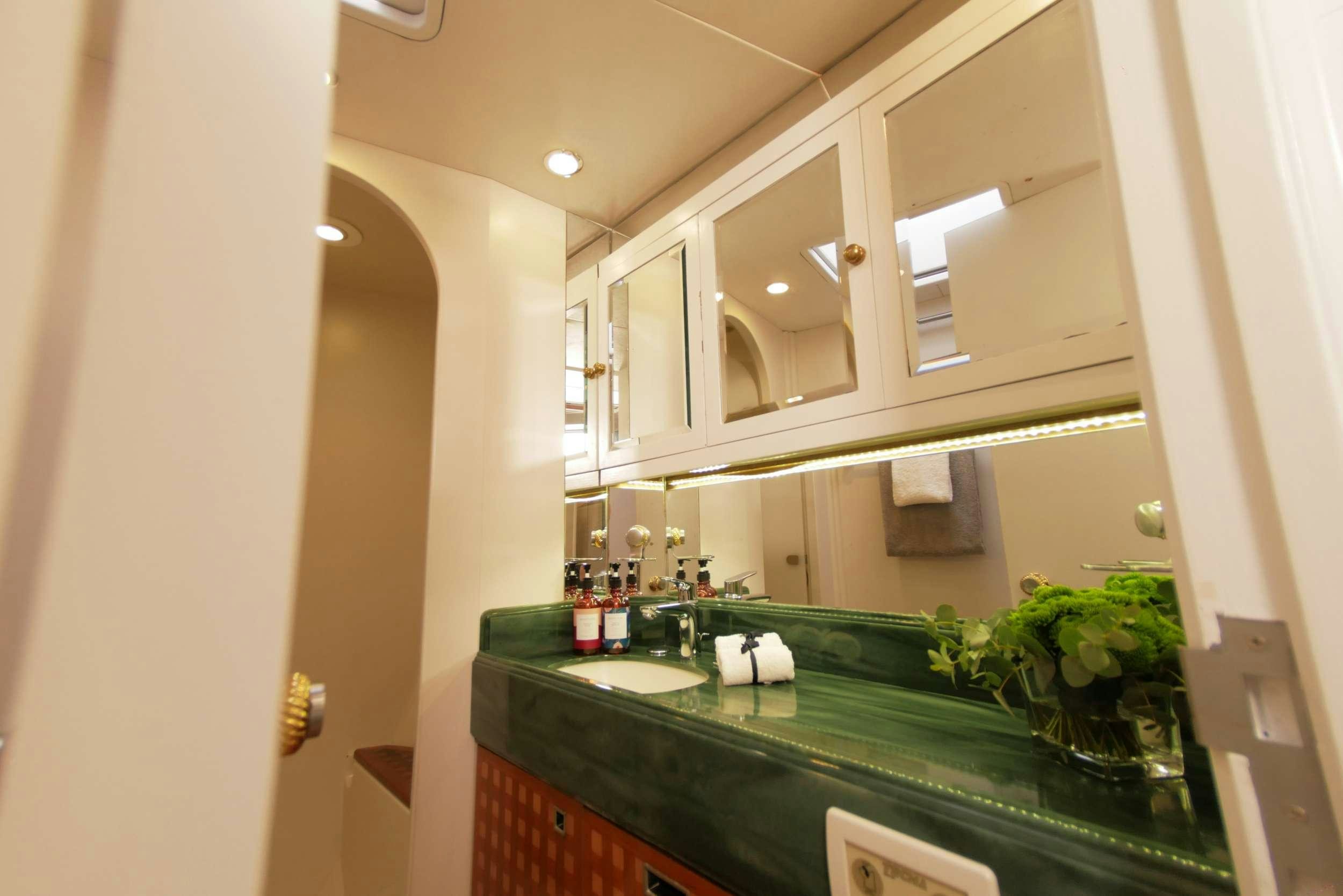 a bathroom with a countertop sink and cabinets aboard ELTON Yacht for Charter