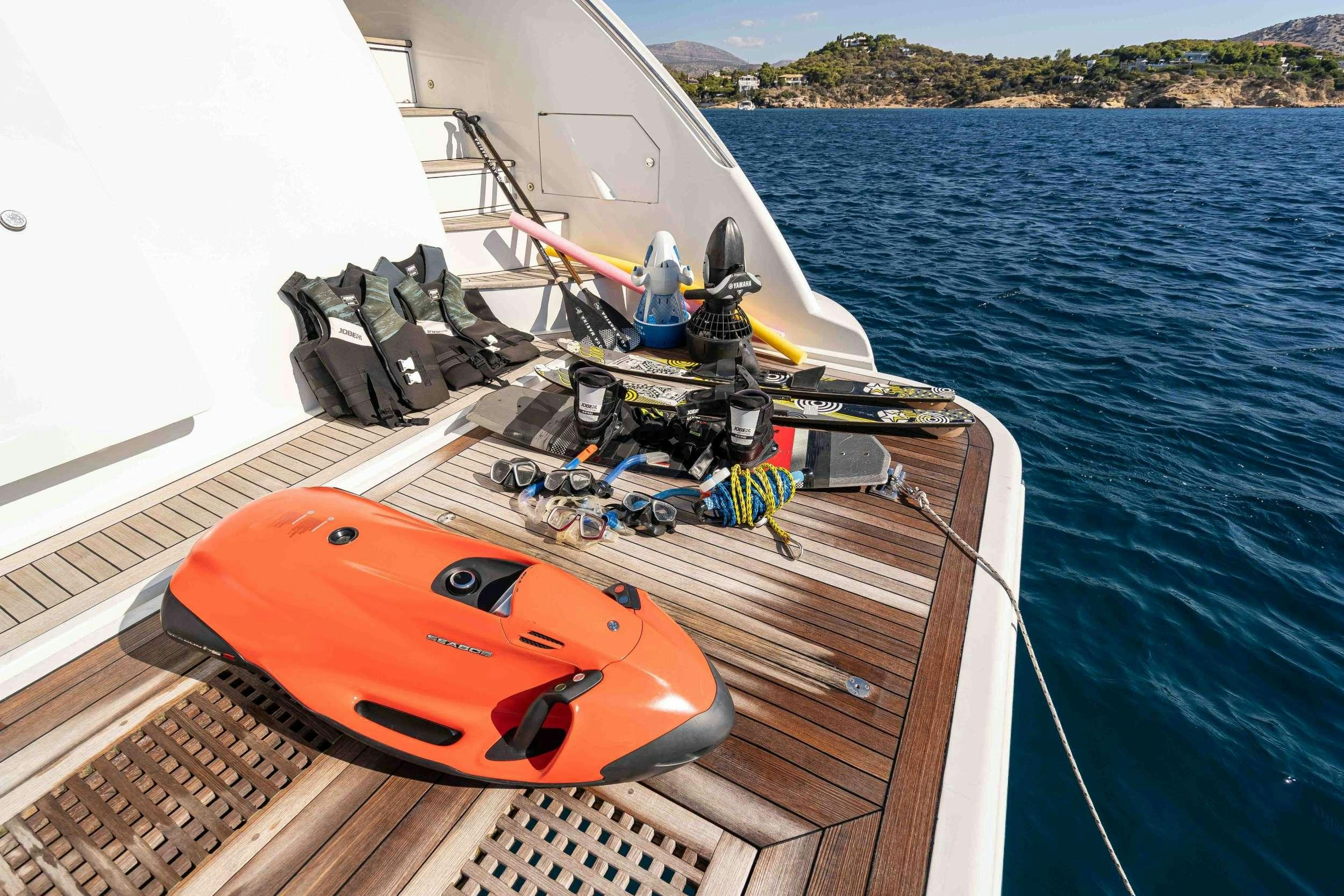 a boat with a motor attached to the front aboard KOUKLES Yacht for Charter