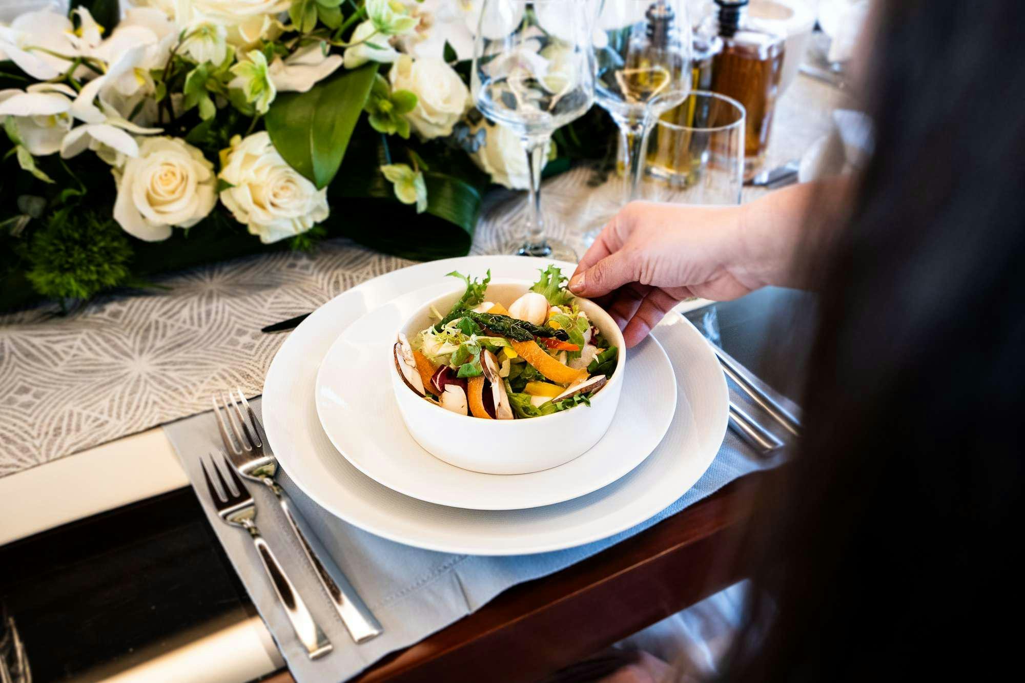 a plate of food on a table aboard KOUKLES Yacht for Charter