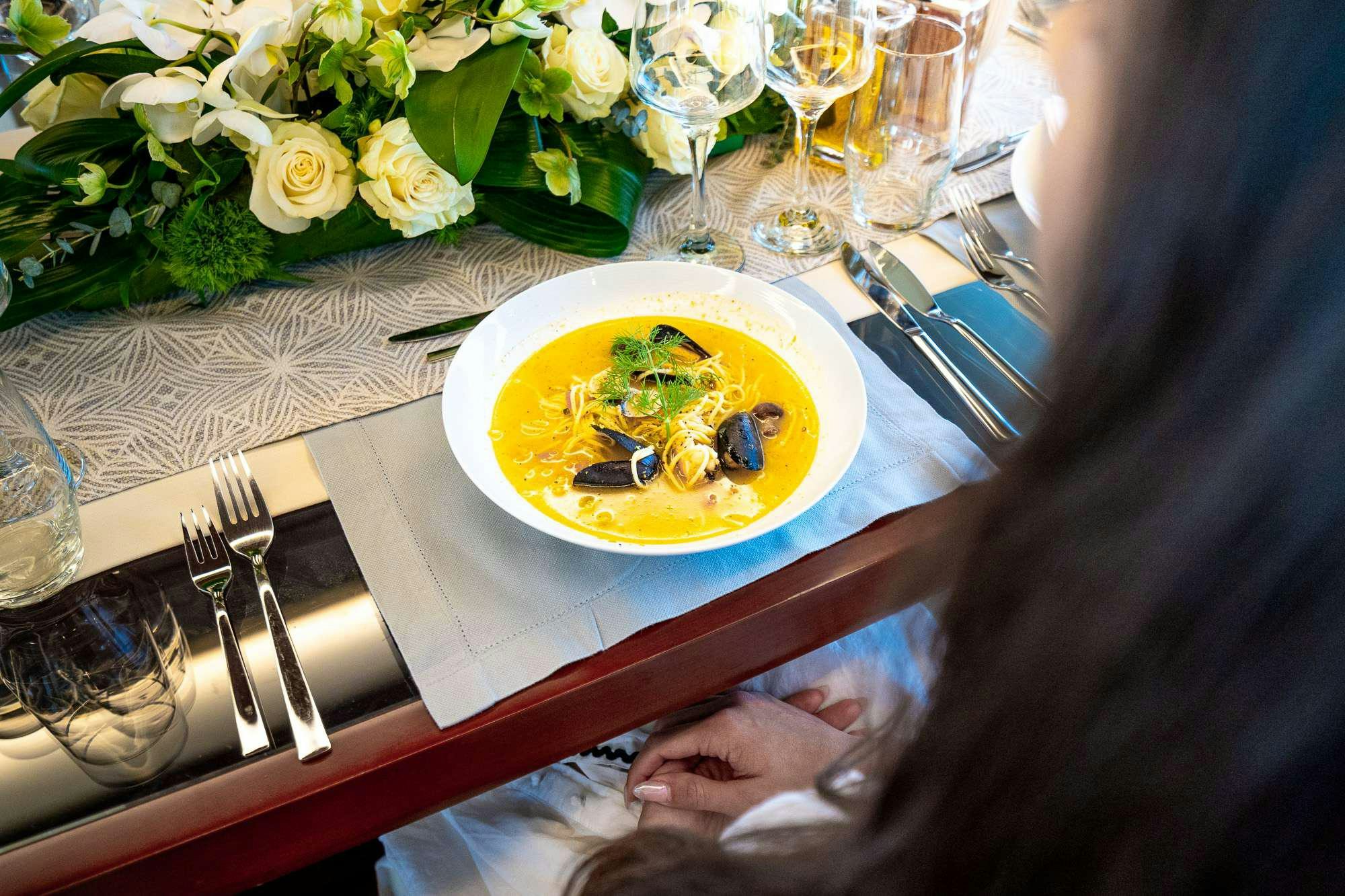 a plate of food on a table aboard KOUKLES Yacht for Charter
