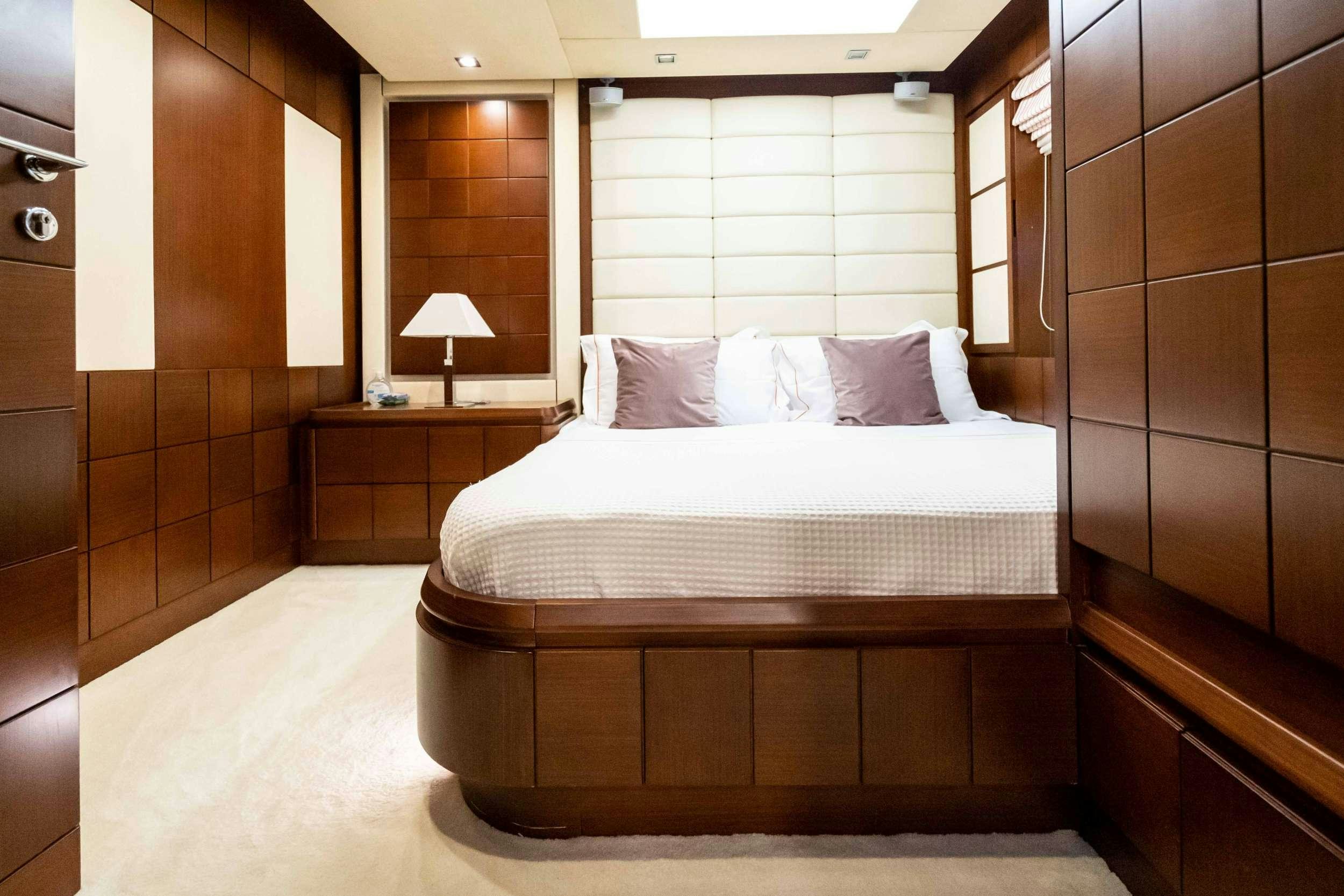 a bed in a room aboard KOUKLES Yacht for Charter